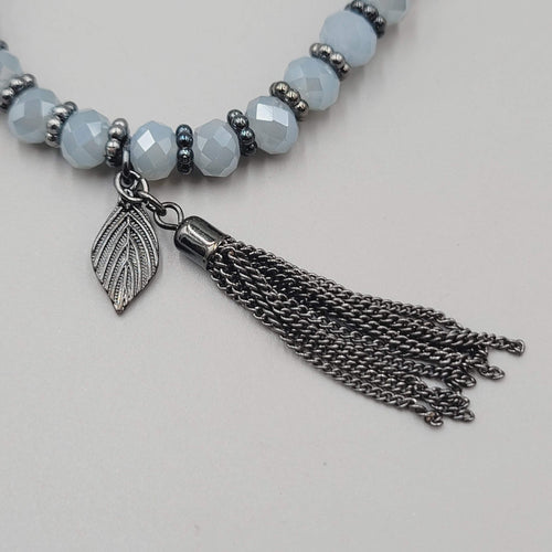 Blue Gray Faceted Crystal Bead Bracelet Gin Metal Gray Tassel Elastic 7 in