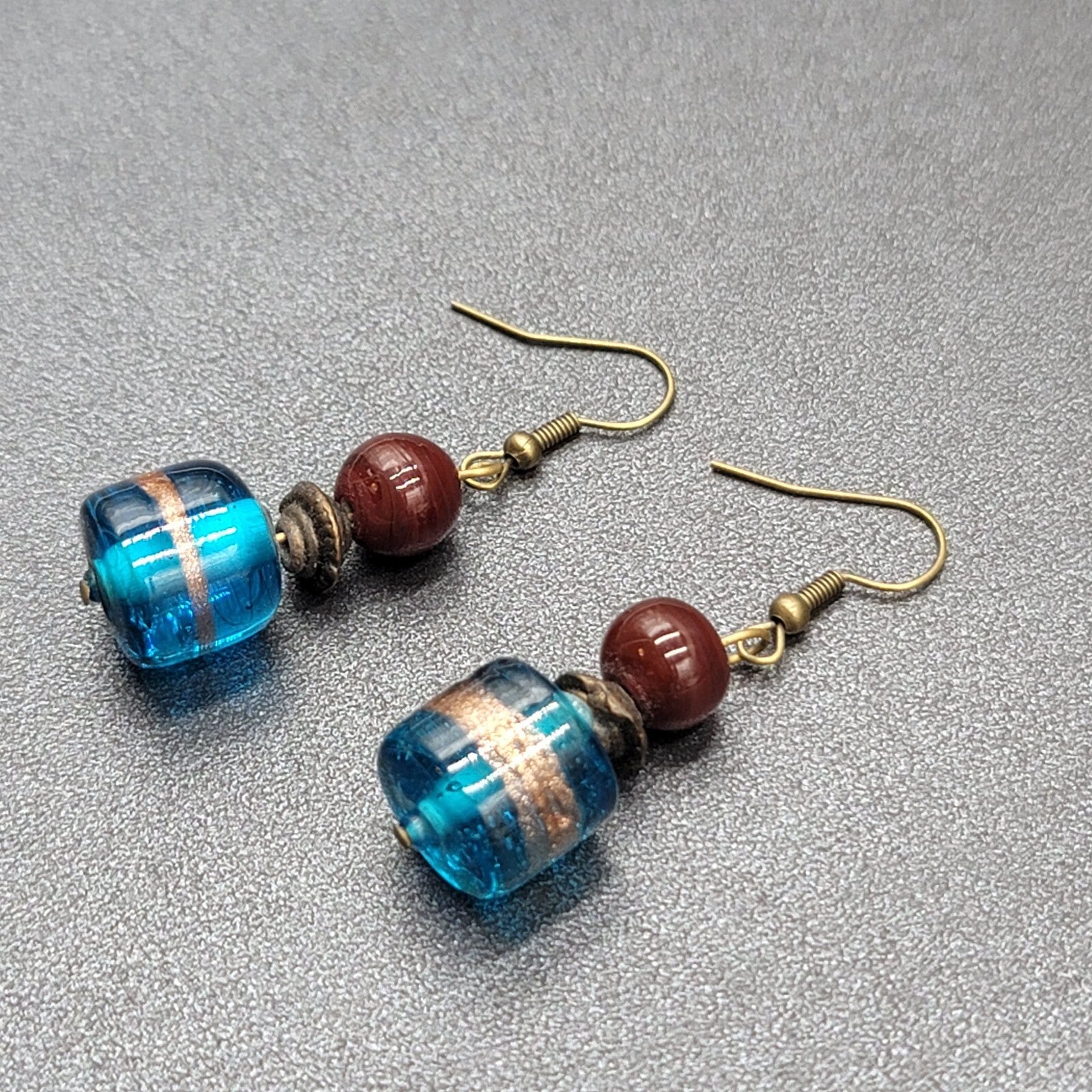 Pierced Earrings Bronze tone Art Glass Blue Bead Dangle 1.25"