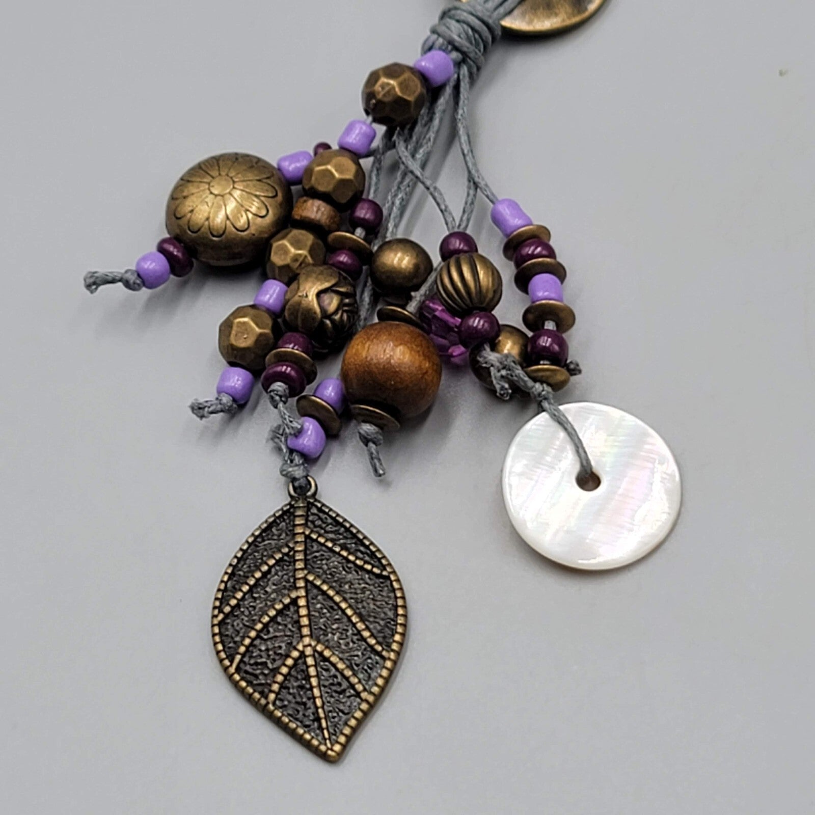 Long Charm Y Drop Necklace Bronze tone Purple Bead Gray Cord 32"