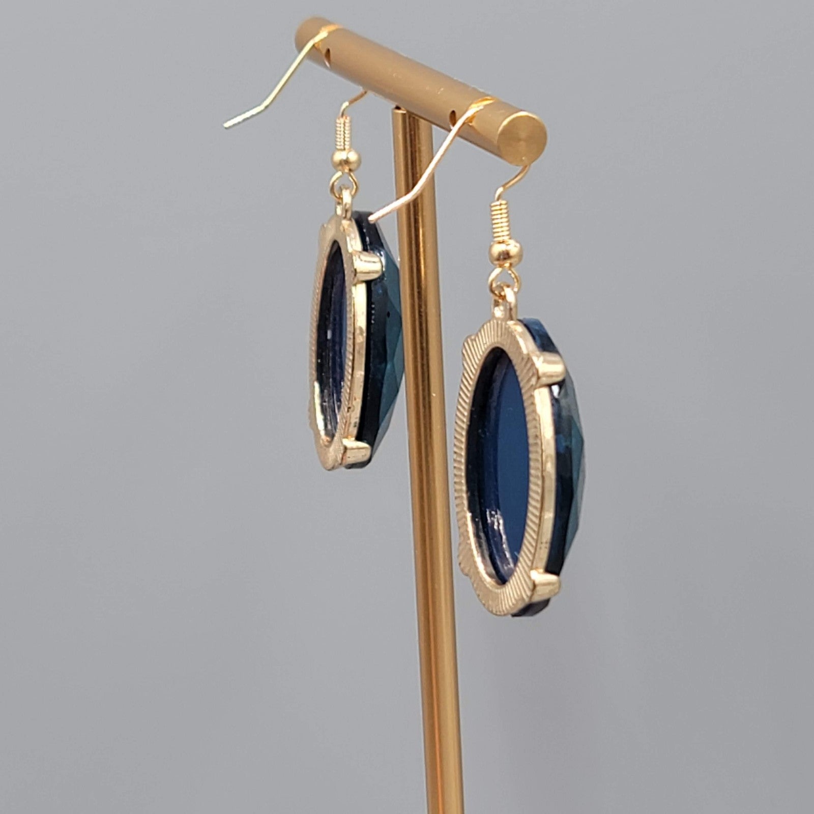 Blue Oval Faceted Swirl Resin Pierced Earrings Gold tone Dangle 1.25 in