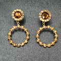 Pierced Earrings Gold tone Brown Faceted Crystal Open Round Dangle 1 7/8"