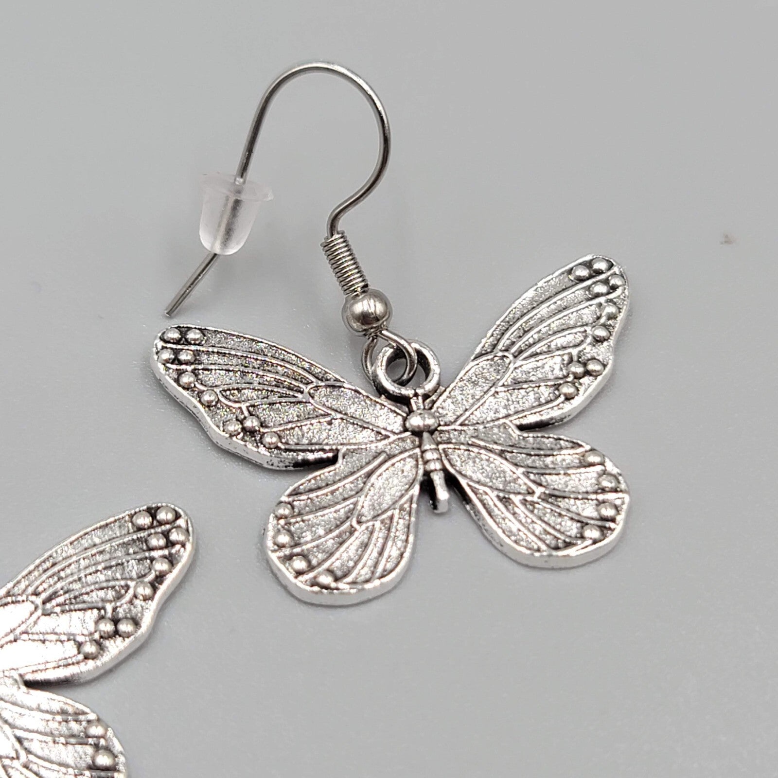 Butterfly Pierced Earrings Silver tone Embossed Dangle 3/4"