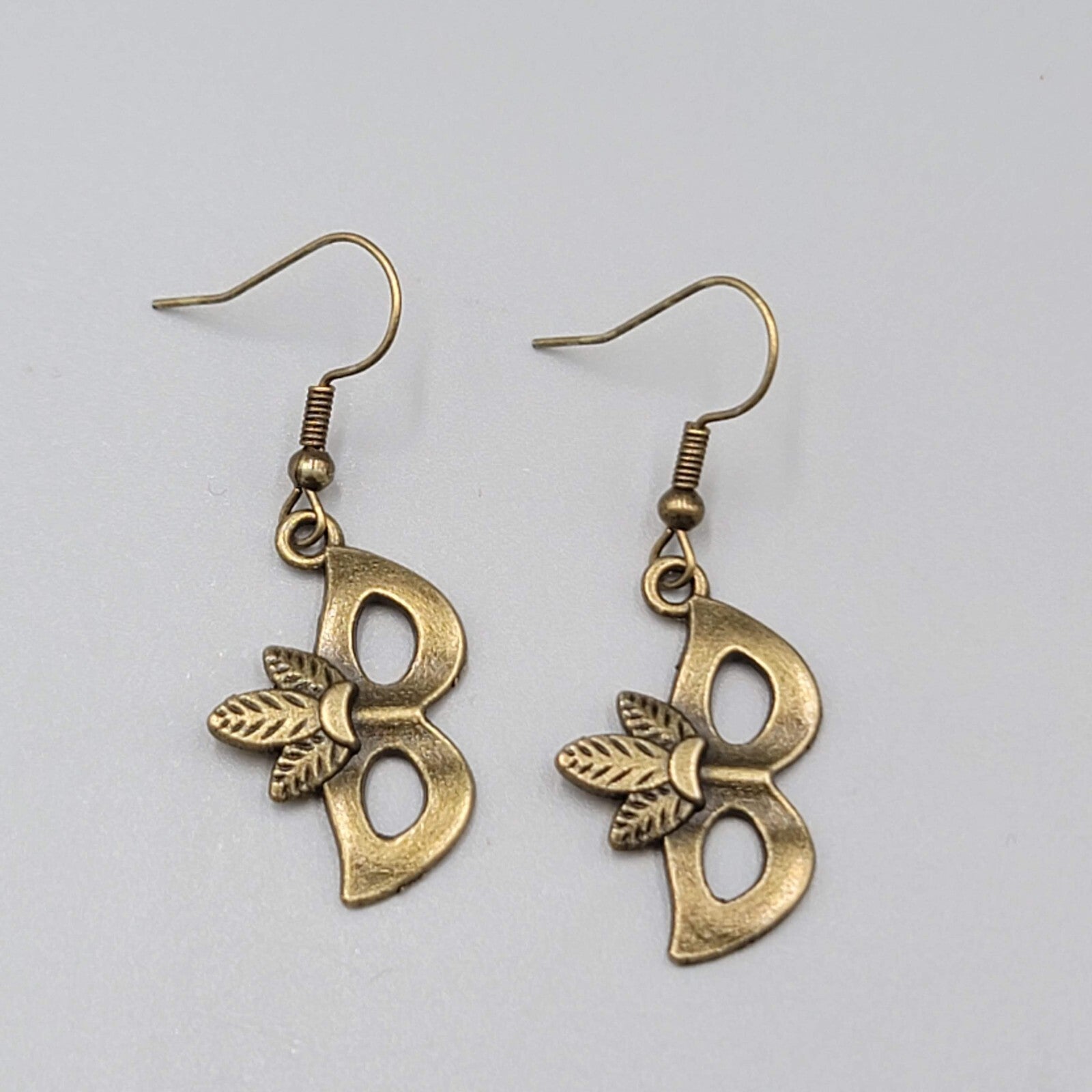Masquerade Mask Pierced Earrings Bronze tone Metal Embossed Leaves Dangle  1"