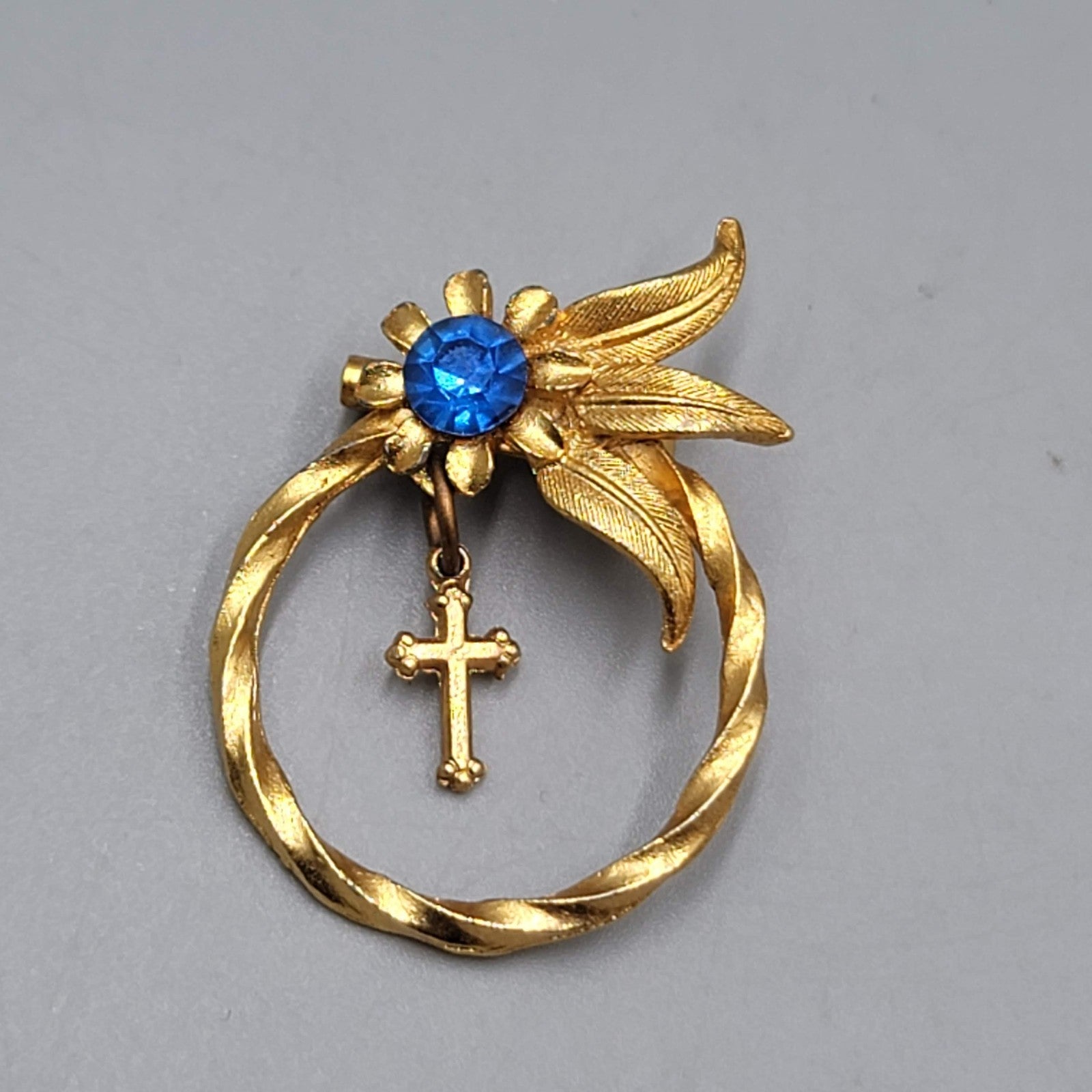 Vintage Cross Bow Blue Rhinestone Brooch Gold tone Dangle 1.25"