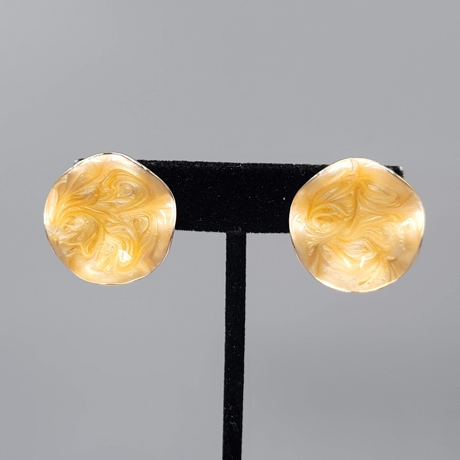 Vintage AVON Clip on Earrings Gold tone Light Orange Swirl Enamel Wavy Round 1"
