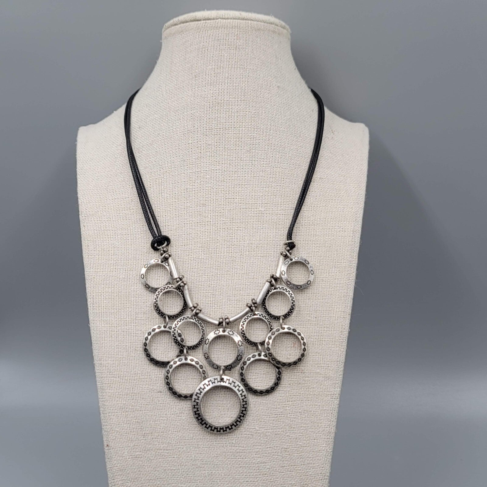 Multiple Open Rings Necklace Embossed Silver tone Black Cord 18"