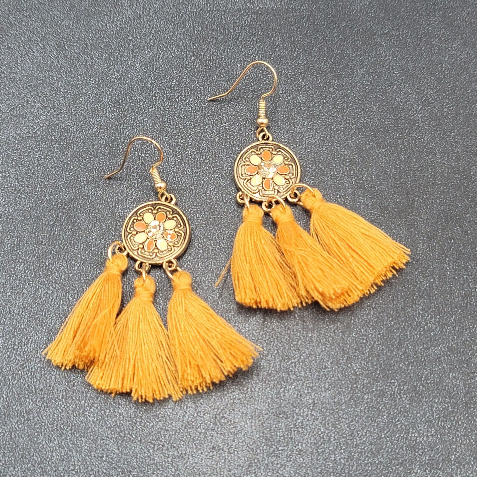 Pierced Earrings Gold tone Orange Tassel Rhinestone Medallion Dangle 1.75"
