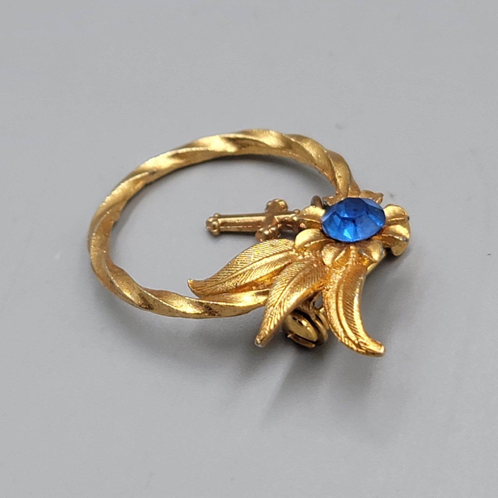 Vintage Cross Bow Blue Rhinestone Brooch Gold tone Dangle 1.25"