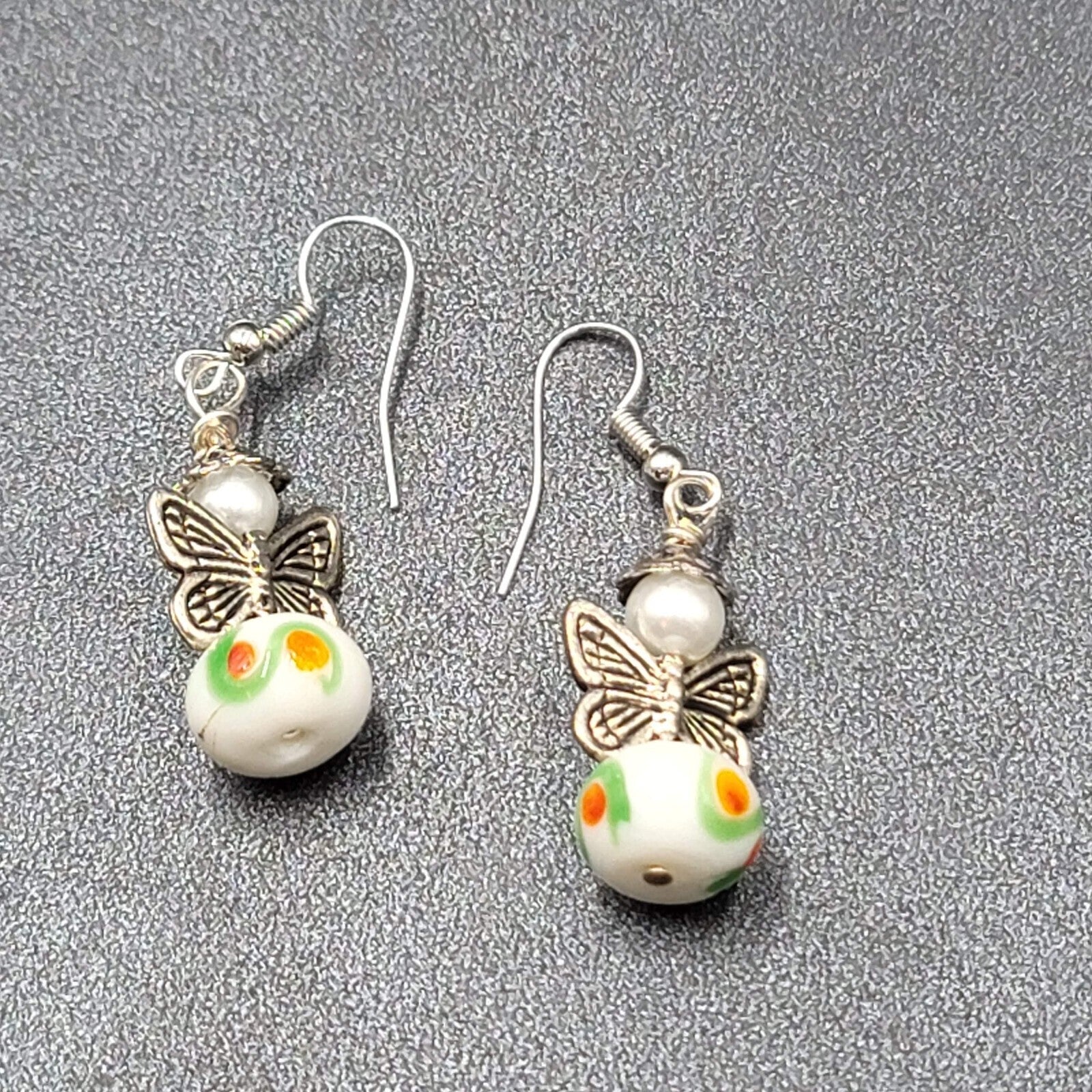 Pierced Earrings Silver tone Angel White Art Glass Bead Dangle 1"