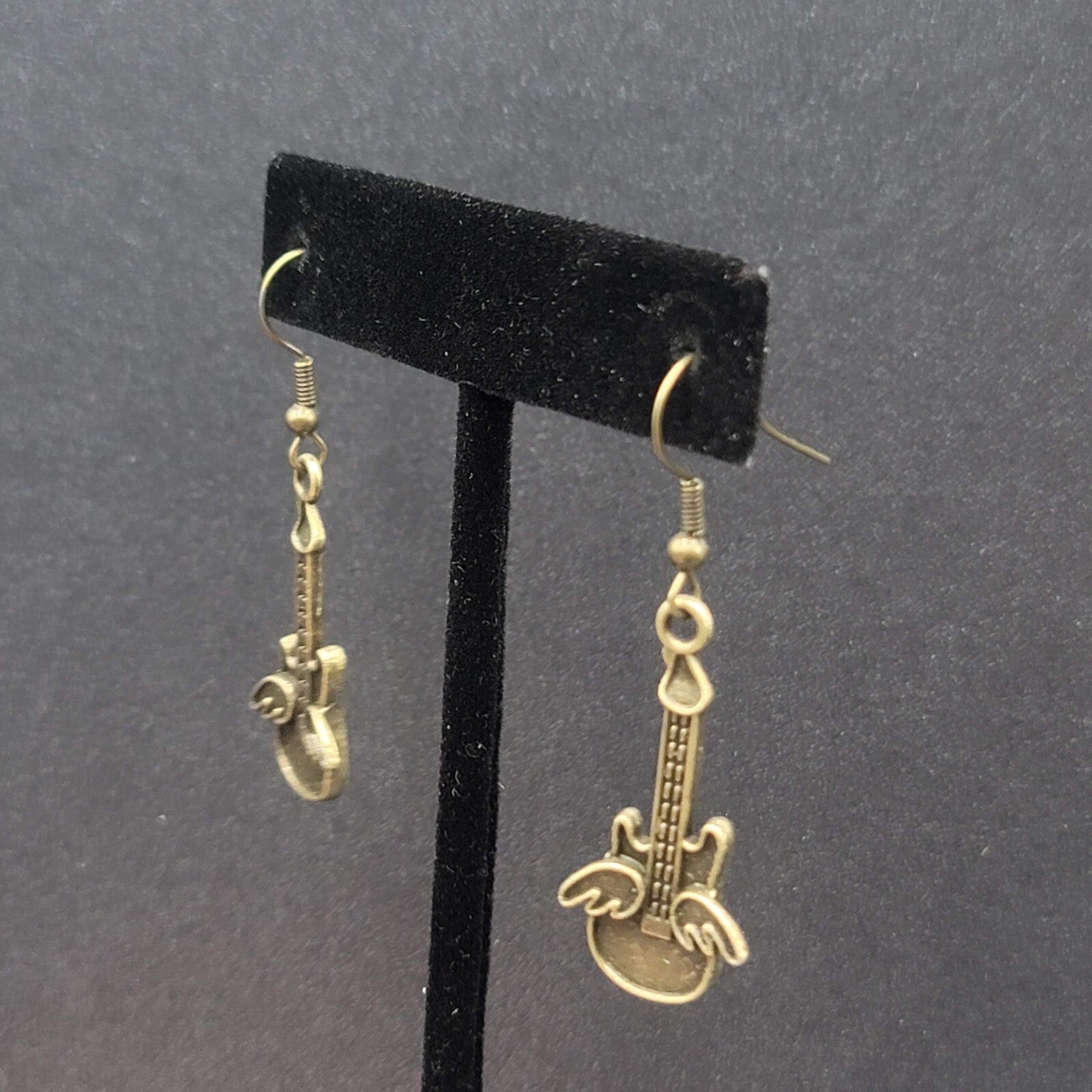 Pierced Earrings Bronze tone Embossed Winged Guitar Dangle 1.25"