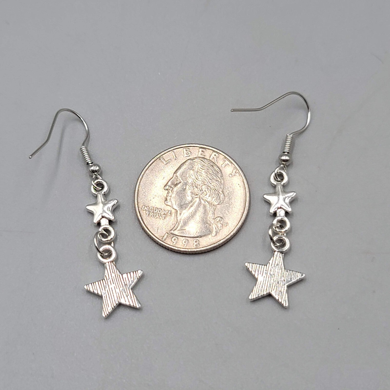 Stars Pierced Earrings Silver tone Embossed Dangle New 1 1/8"