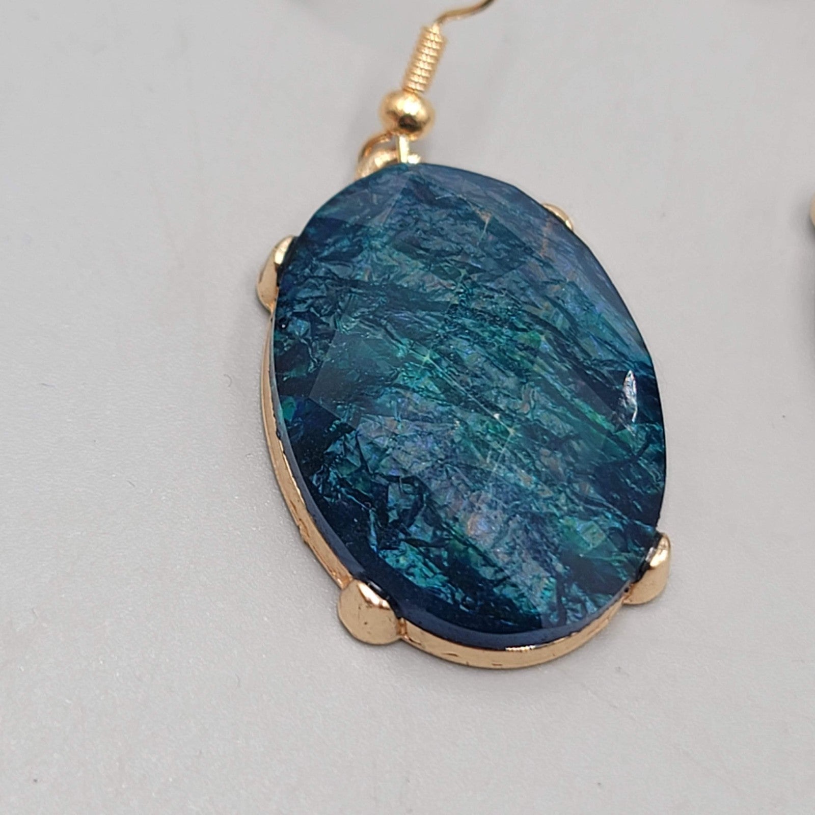 Blue Oval Faceted Swirl Resin Pierced Earrings Gold tone Dangle 1.25 in