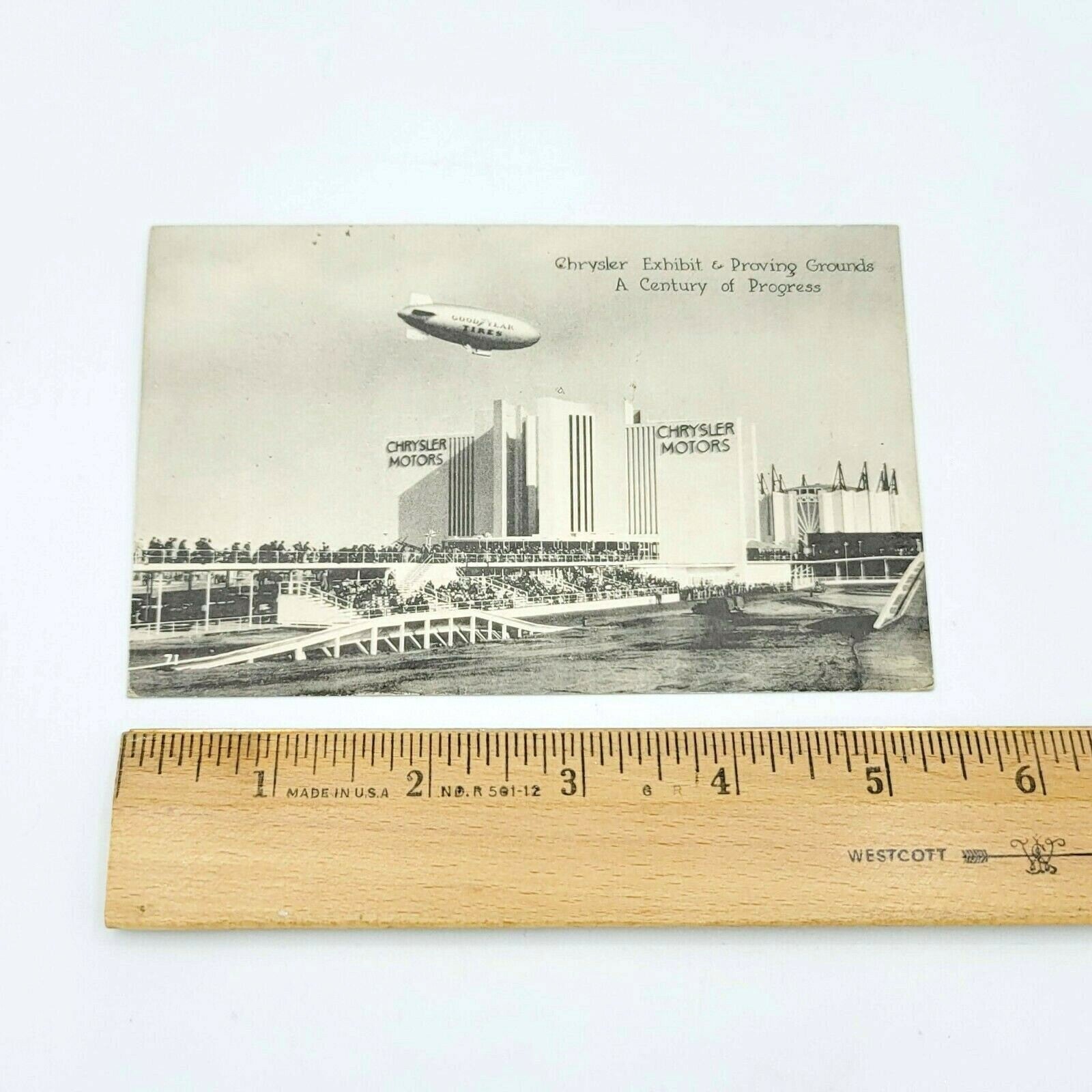 Vintage GOODYEAR BLIMP RELIANCE over Chrysler Motors Chicago ILL Postcard RPPC