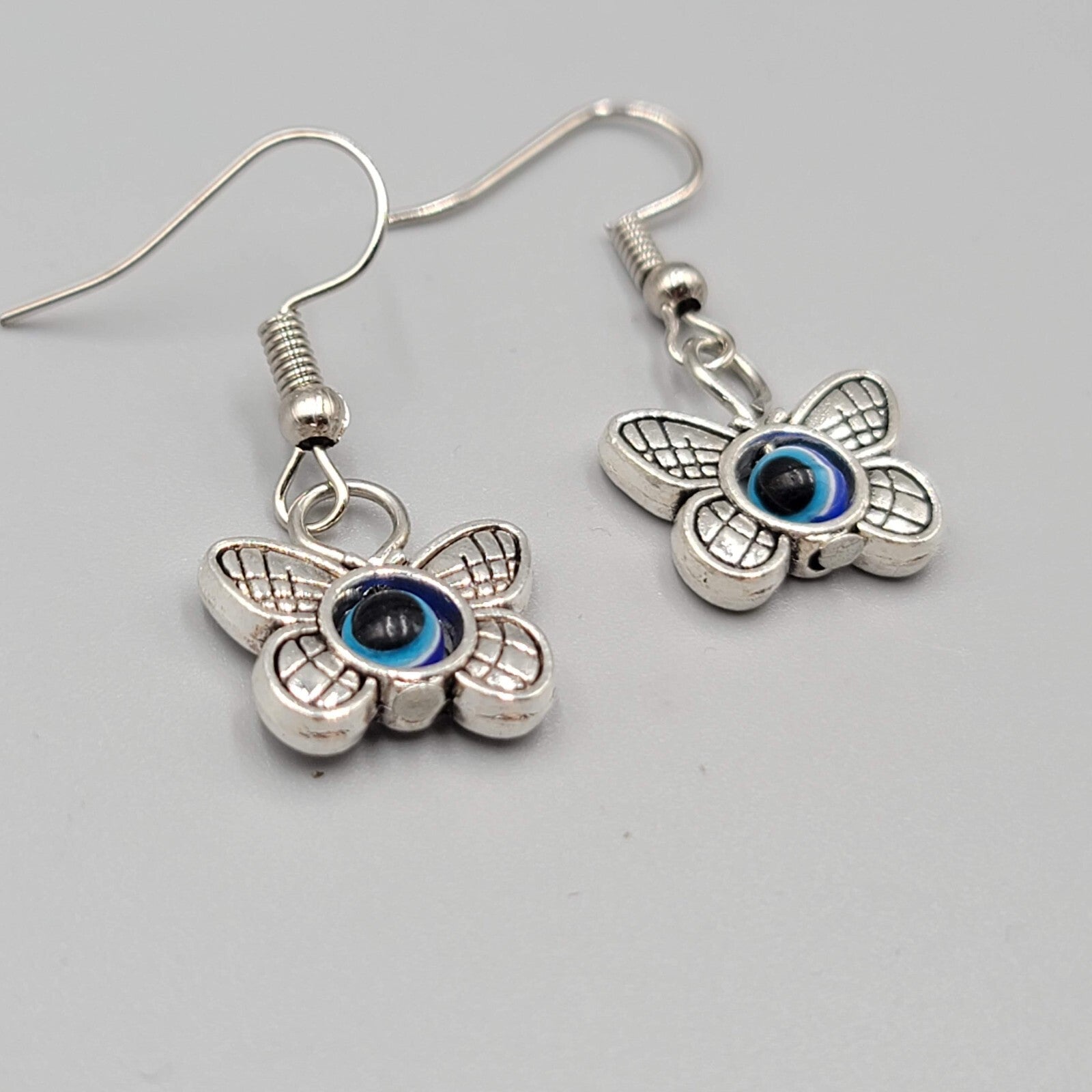 Butterfly Evil Eye Pierced Earrings Silver tone Blue Bead Dangle 5/8"