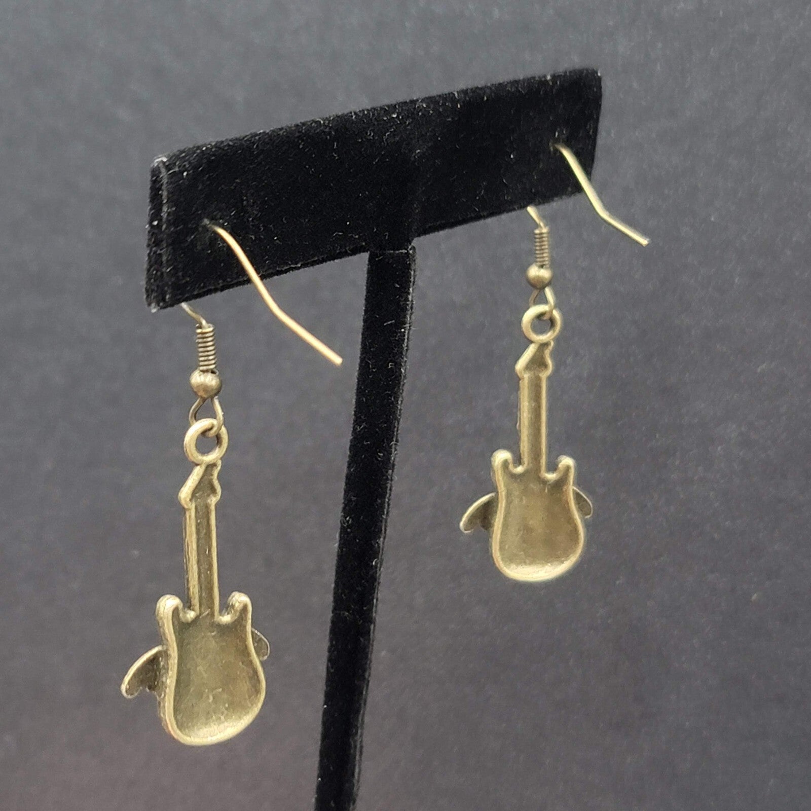 Pierced Earrings Bronze tone Embossed Winged Guitar Dangle 1.25"