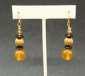 Pierced Earrings Gold tone Orange Black Beaded Statement Dangle 1.5"