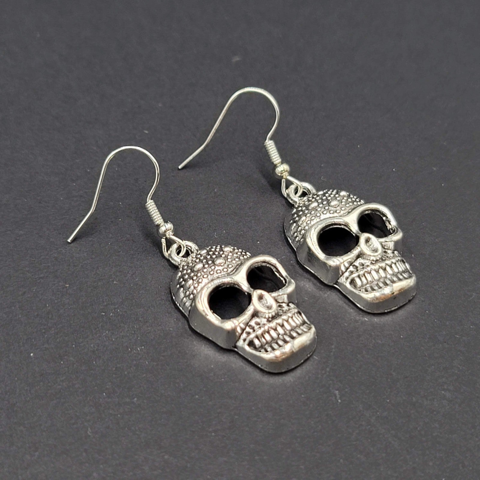 Embossed Skull Silver tone Dangle  Pierced Earrings New Halloween 1 1/8"