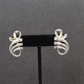 Vintage Clip on Earrings Pat Pend Silver tone Swirl Climber 1.25"