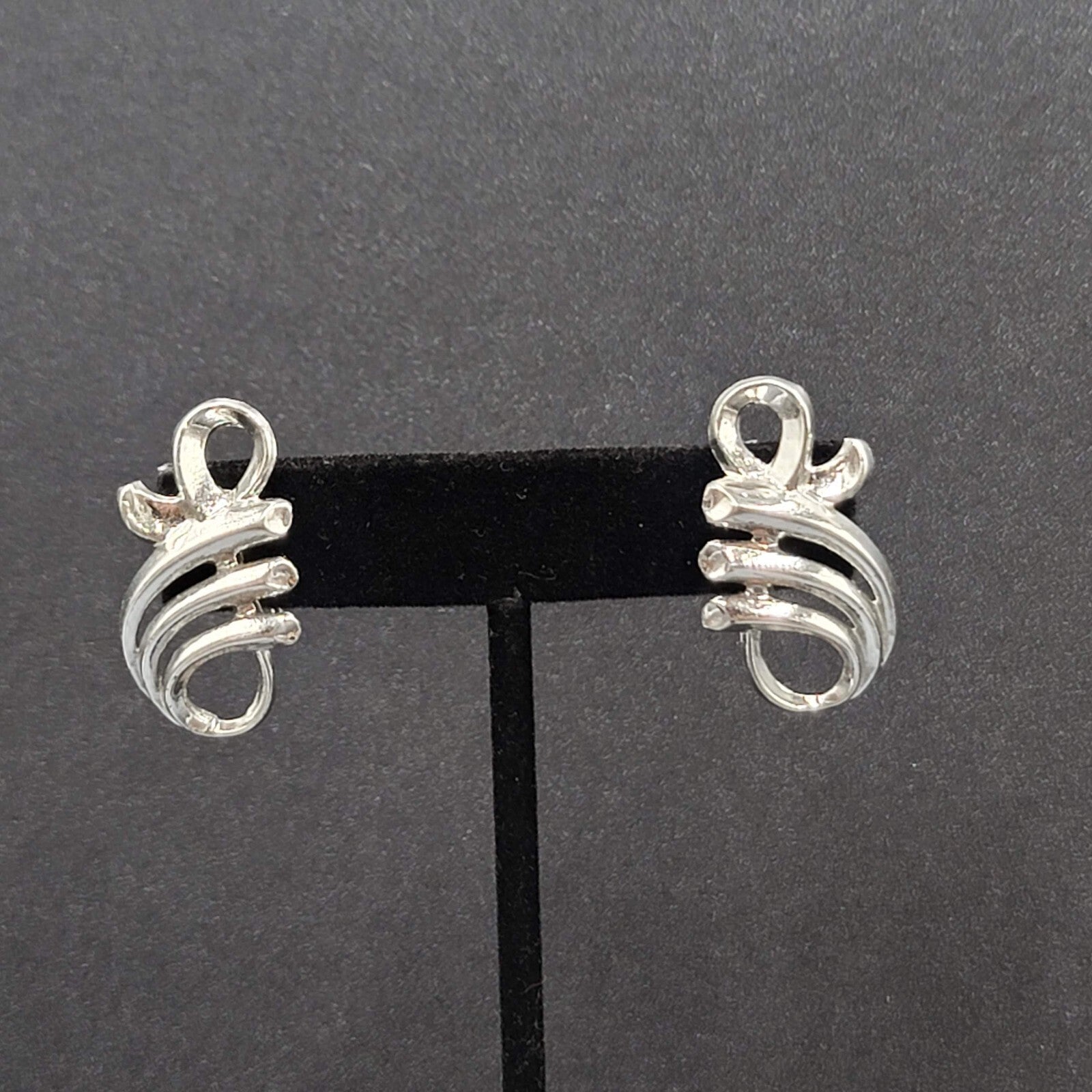 Vintage Clip on Earrings Pat Pend Silver tone Swirl Climber 1.25"