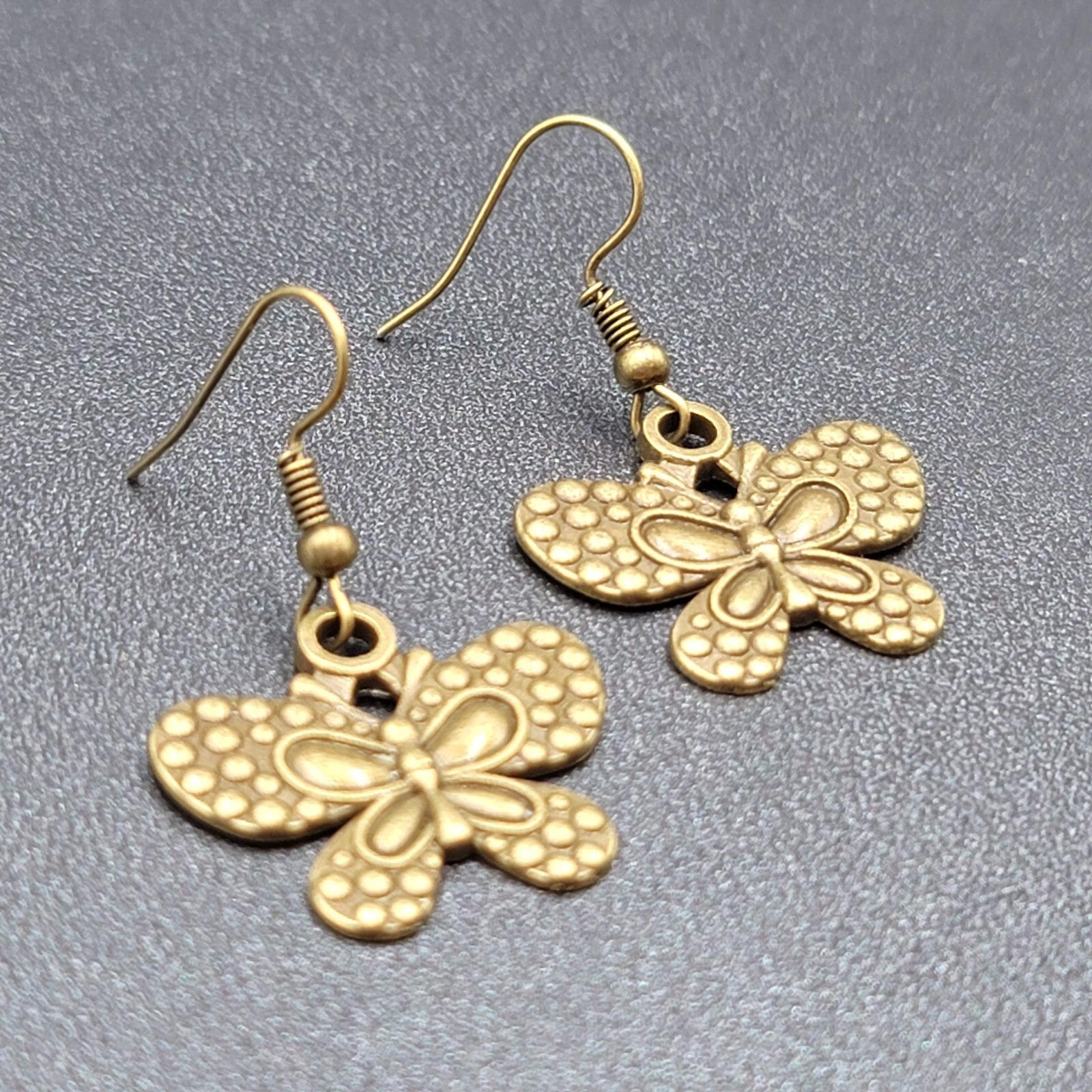 Butterfly Pierced Earrings Dangle Bronze tone Embossed 7/8"
