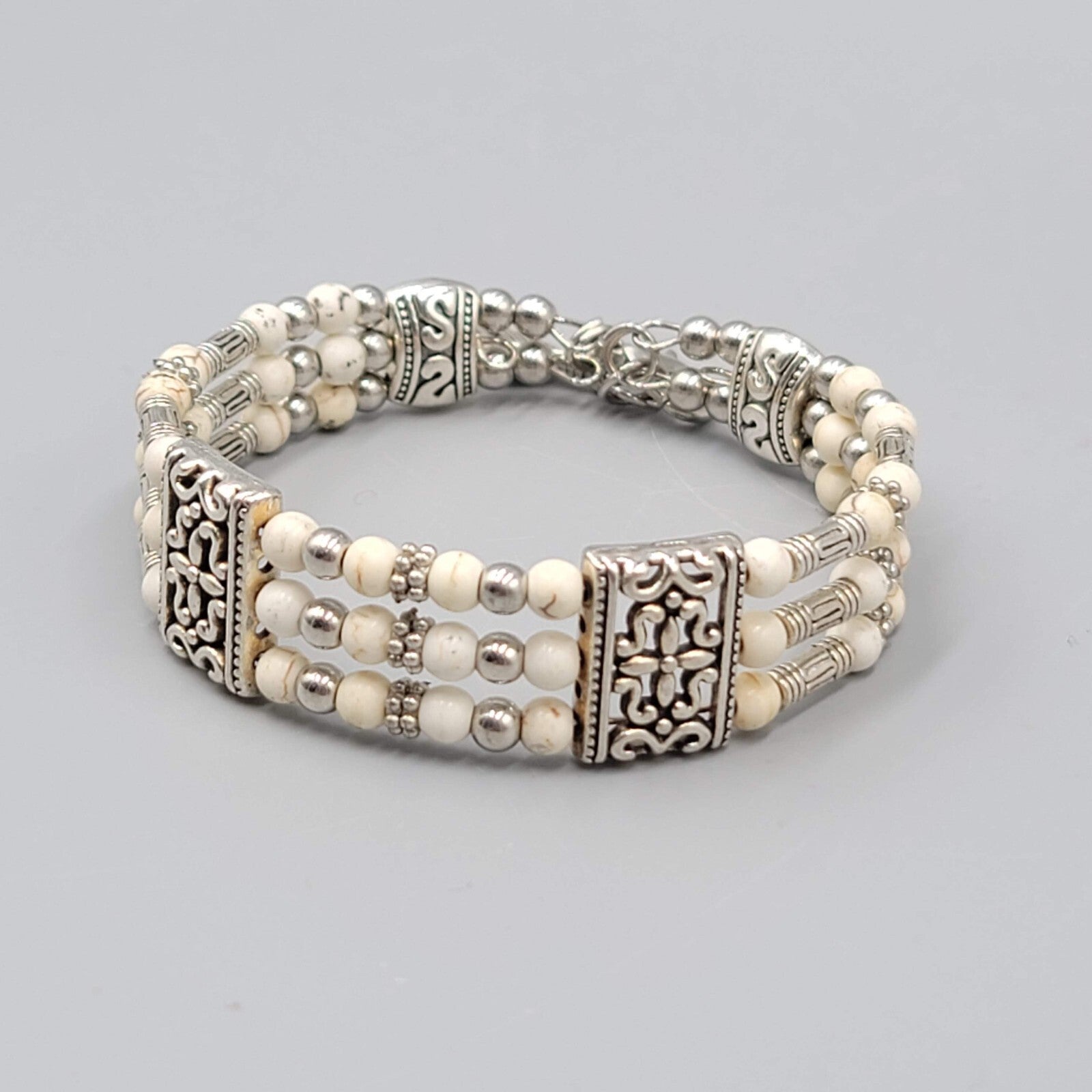 White Stone Bead Bracelet Triple Strand Silver tone Feather Charm 6.75"
