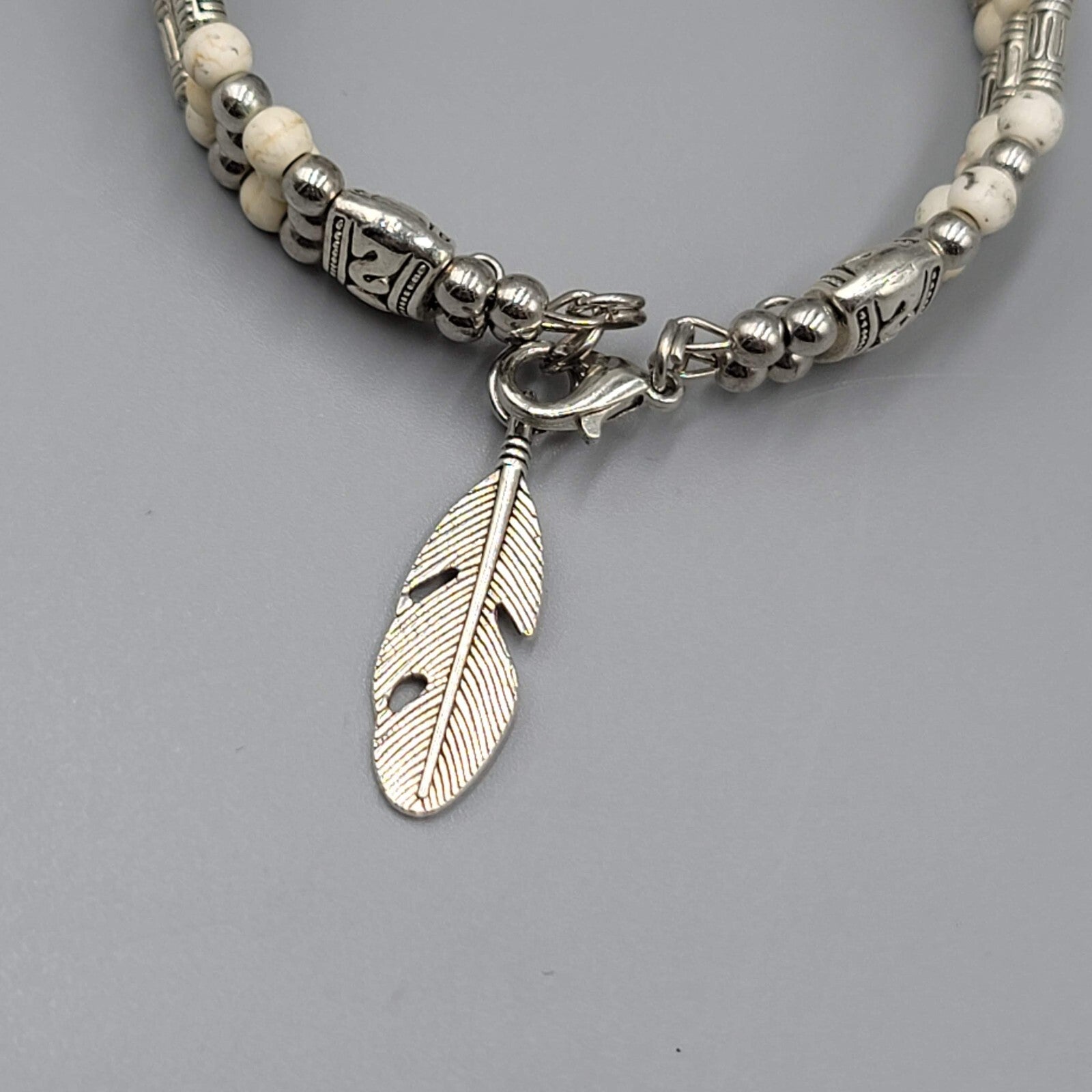 White Stone Bead Bracelet Triple Strand Silver tone Feather Charm 6.75"