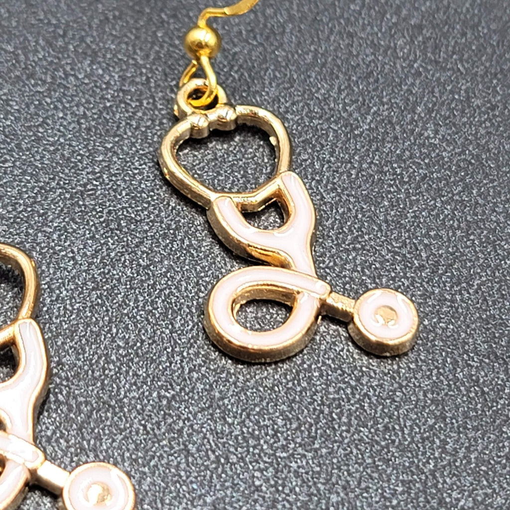Nurse Pierced Earrings White Enamel Stethoscope Gold tone Dangle 1 1/8"