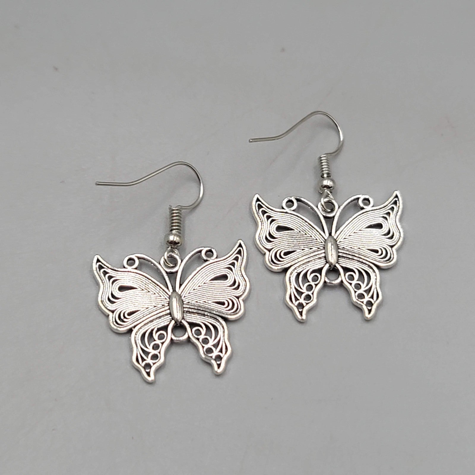 Filigree Butterfly Pierced Earrings Silver tone Dangle 1"