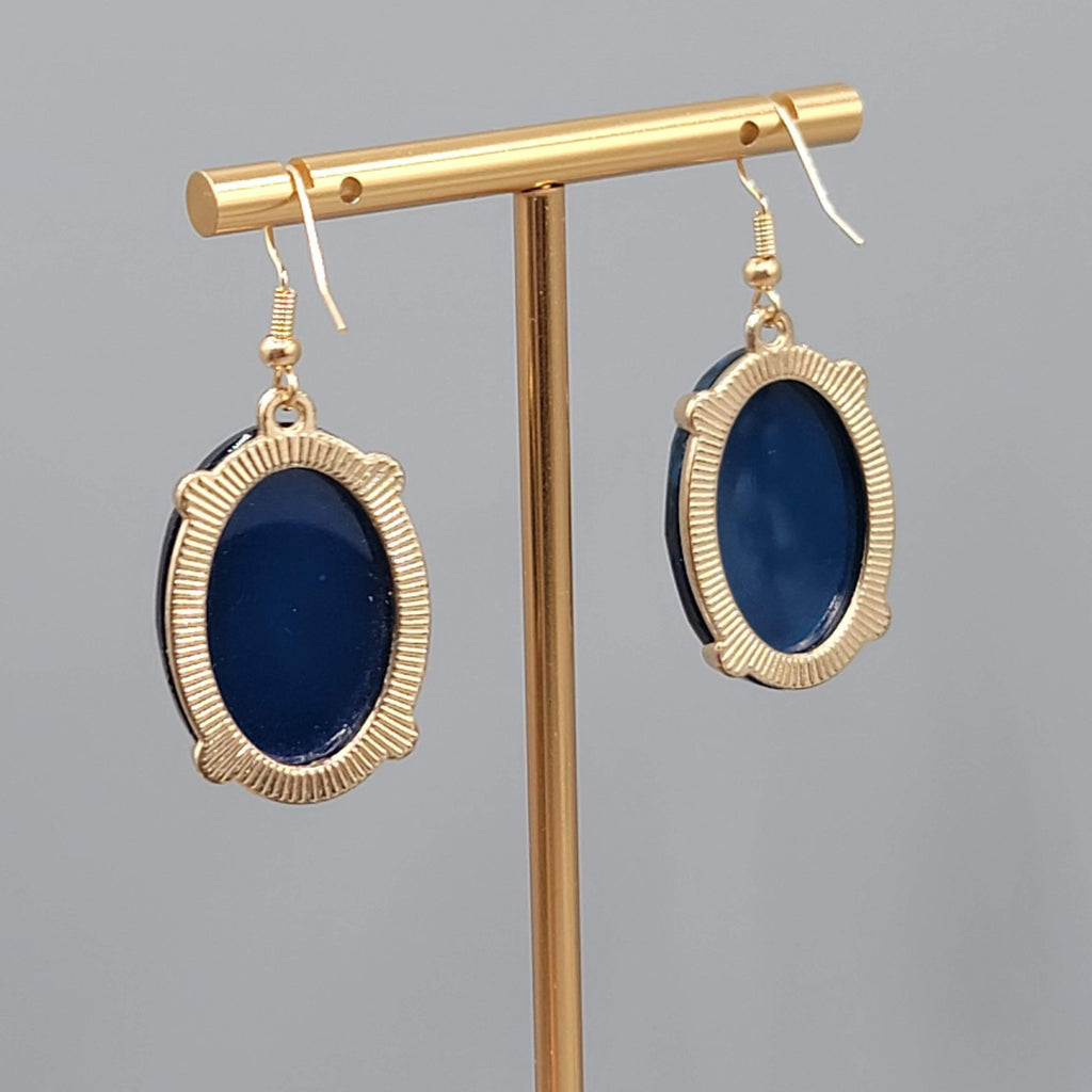Blue Oval Faceted Swirl Resin Pierced Earrings Gold tone Dangle 1.25 in