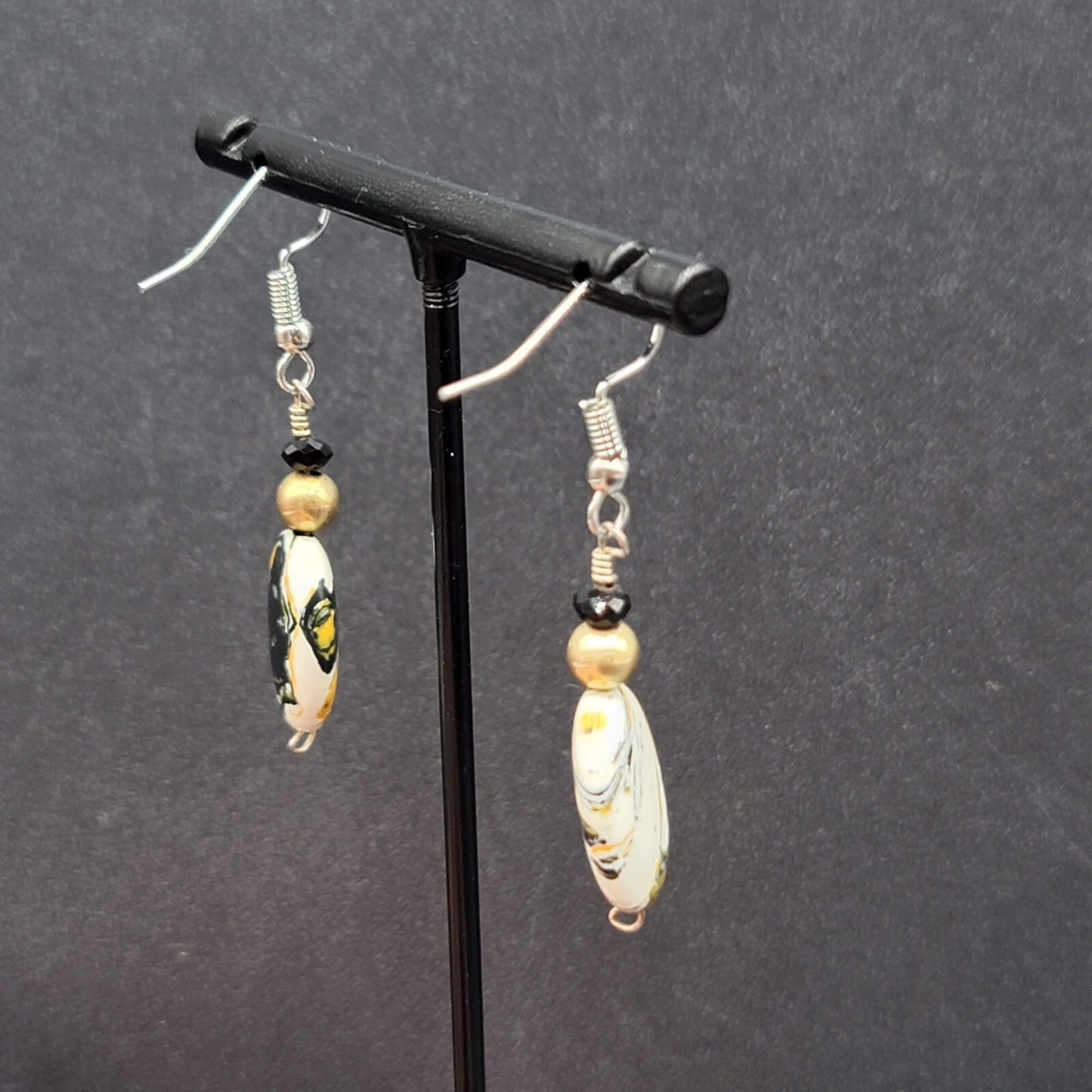 Pierced Earrings Silver tone Black White Yellow Art Glass Oval Bead Dangle 1.25"