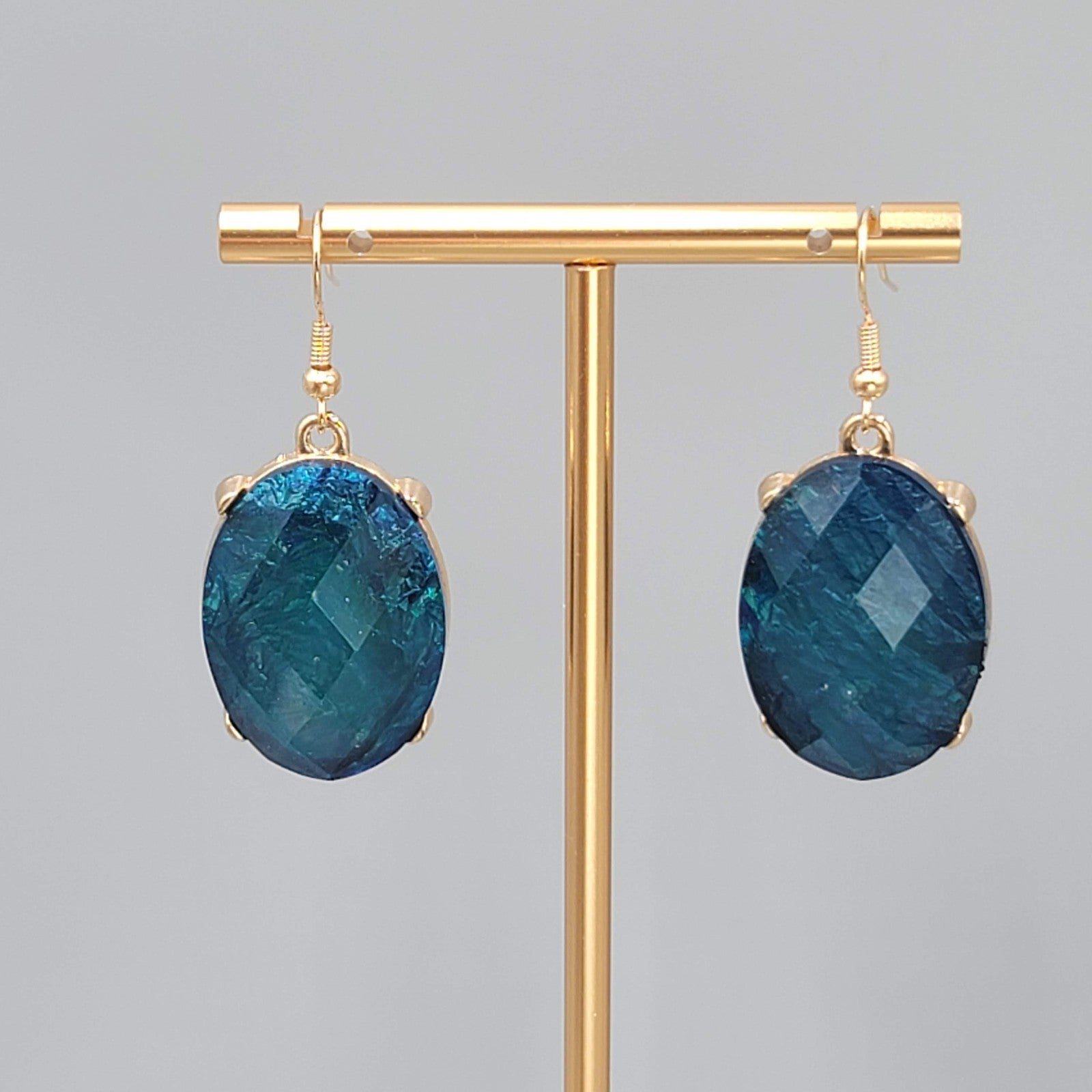 Blue Oval Faceted Swirl Resin Pierced Earrings Gold tone Dangle 1.25 in