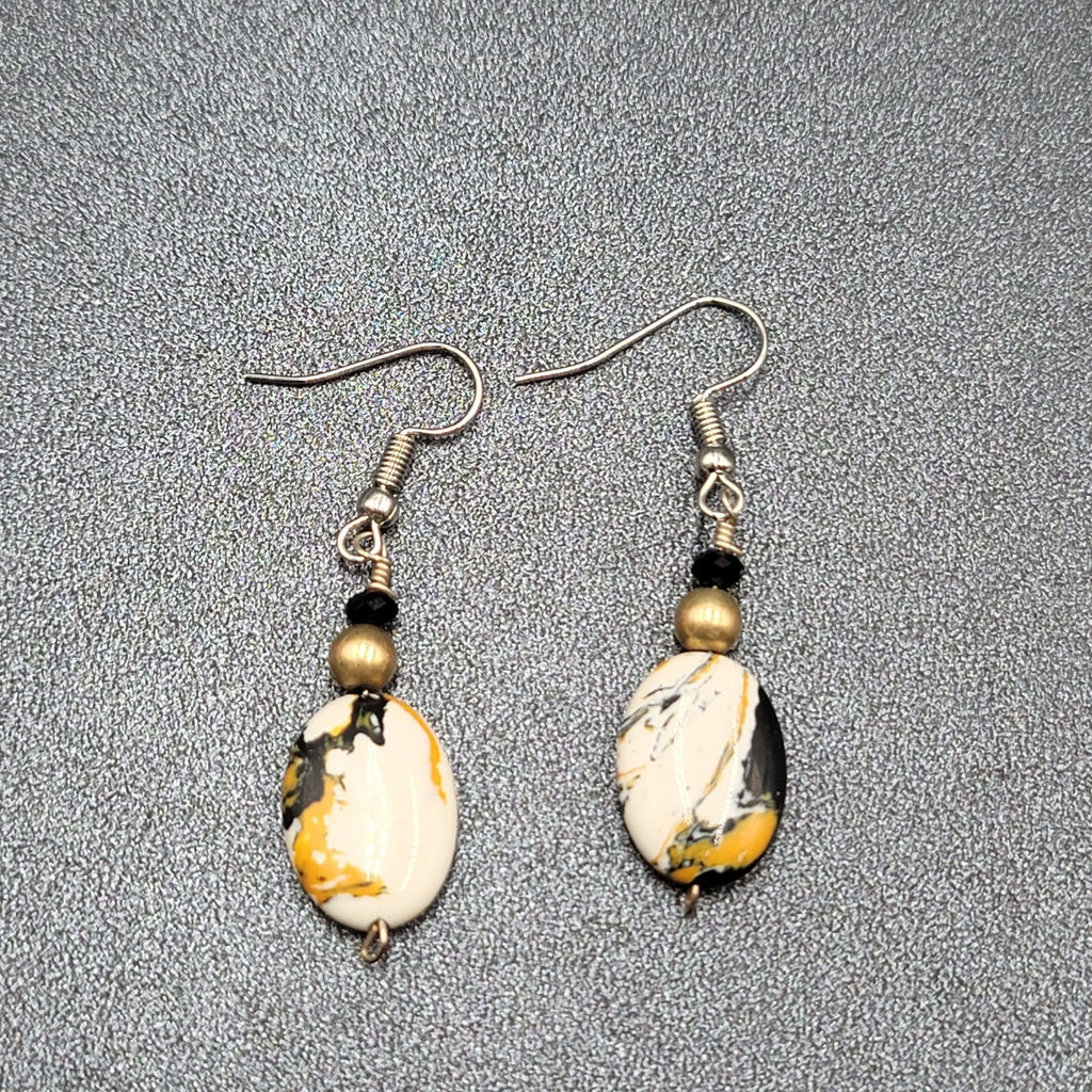 Pierced Earrings Silver tone Black White Yellow Art Glass Oval Bead Dangle 1.25"