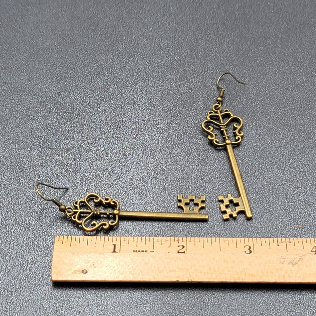 Pierced Earrings Bronze tone Long Antique Skeleton Key Dangle 2.25"
