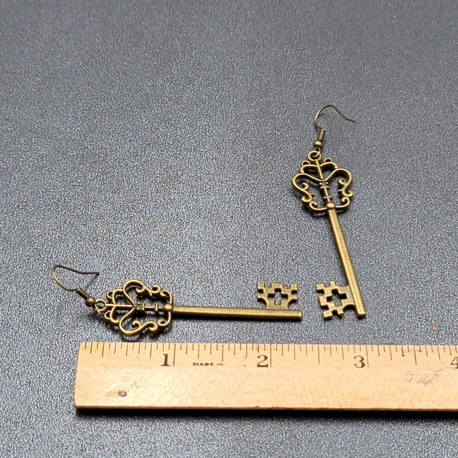 Pierced Earrings Bronze tone Long Antique Skeleton Key Dangle 2.25"