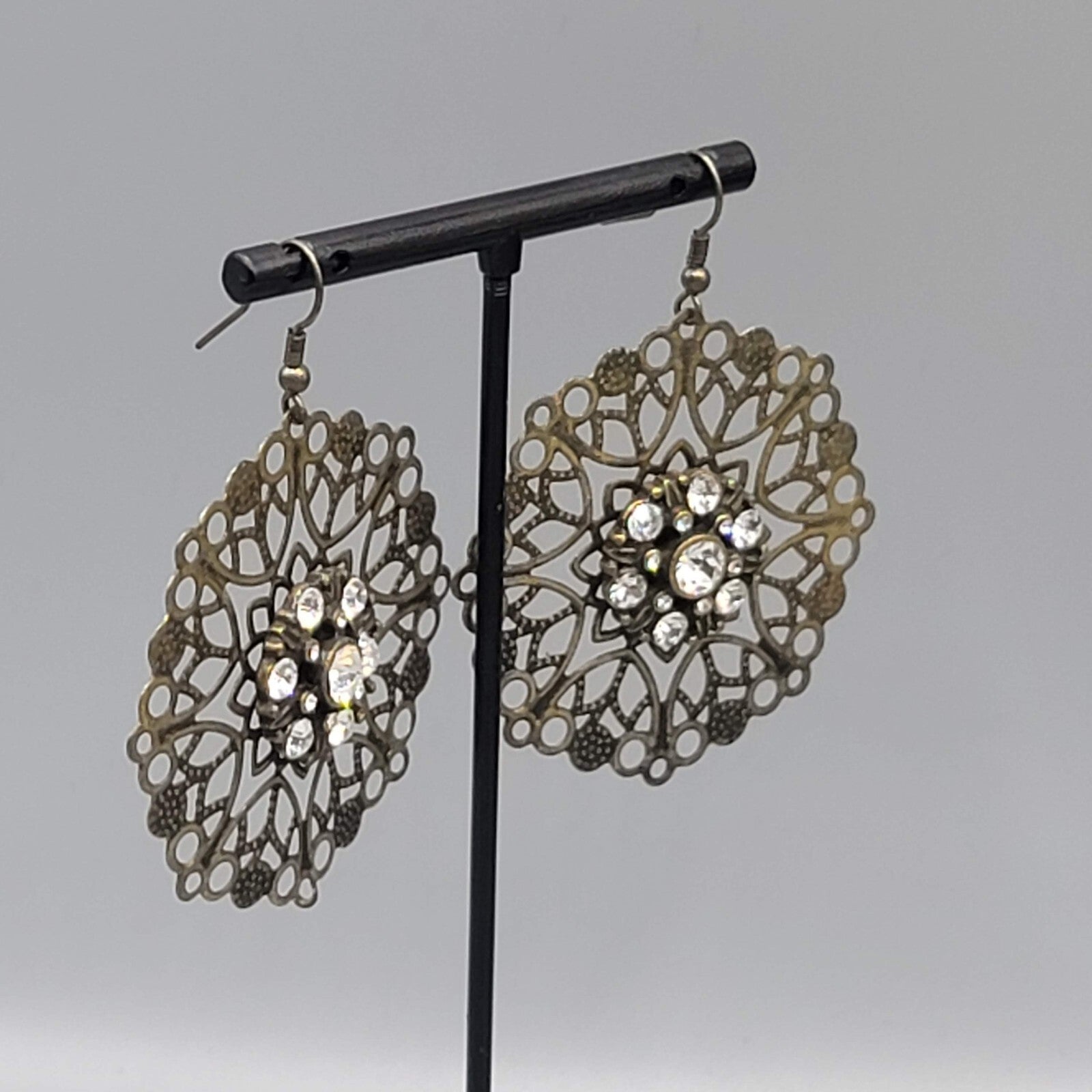 Pierced Earrings Bronze tone Large Metal Filigree Rhinestone Center Boho 1.75"