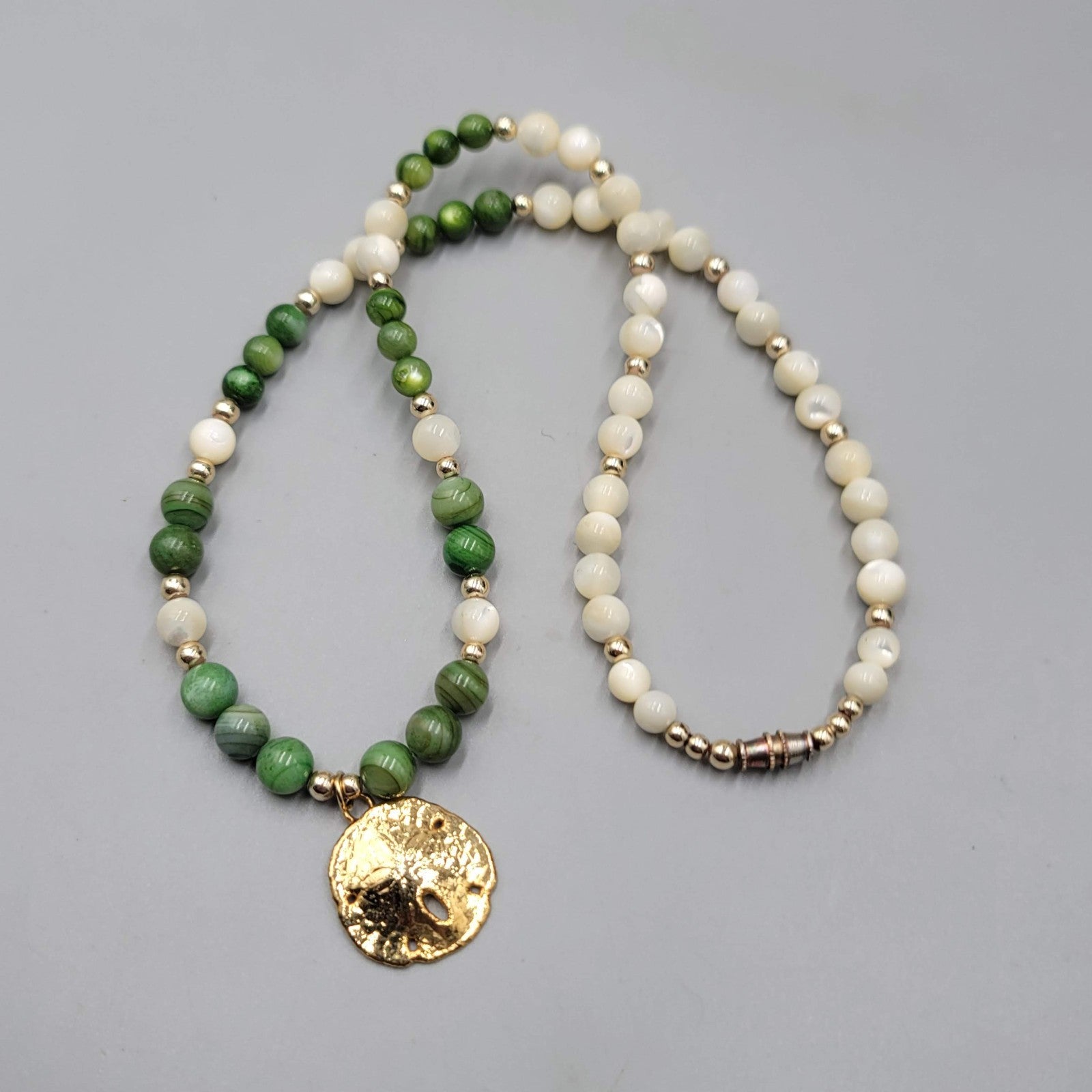 Vintage Sand Dollar Necklace Mother of Pearl Green Stone Beads Gold tone 18"