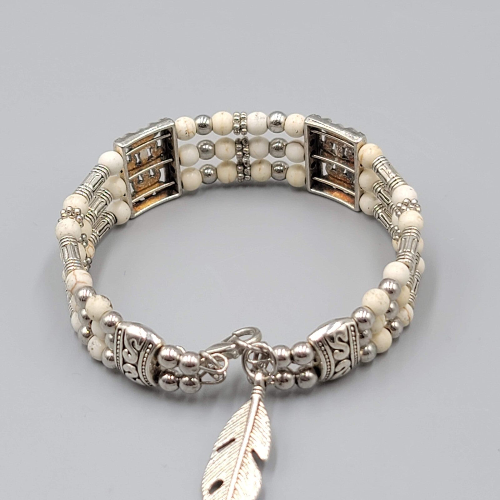 White Stone Bead Bracelet Triple Strand Silver tone Feather Charm 6.75"