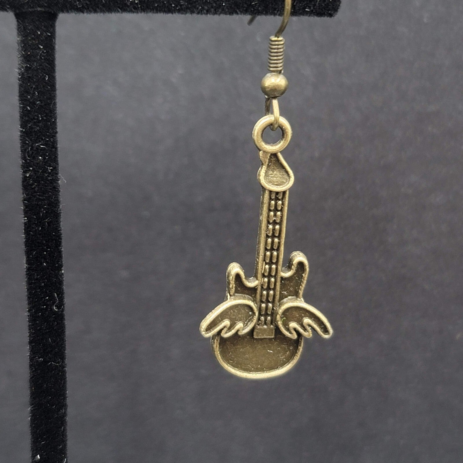 Pierced Earrings Bronze tone Embossed Winged Guitar Dangle 1.25"