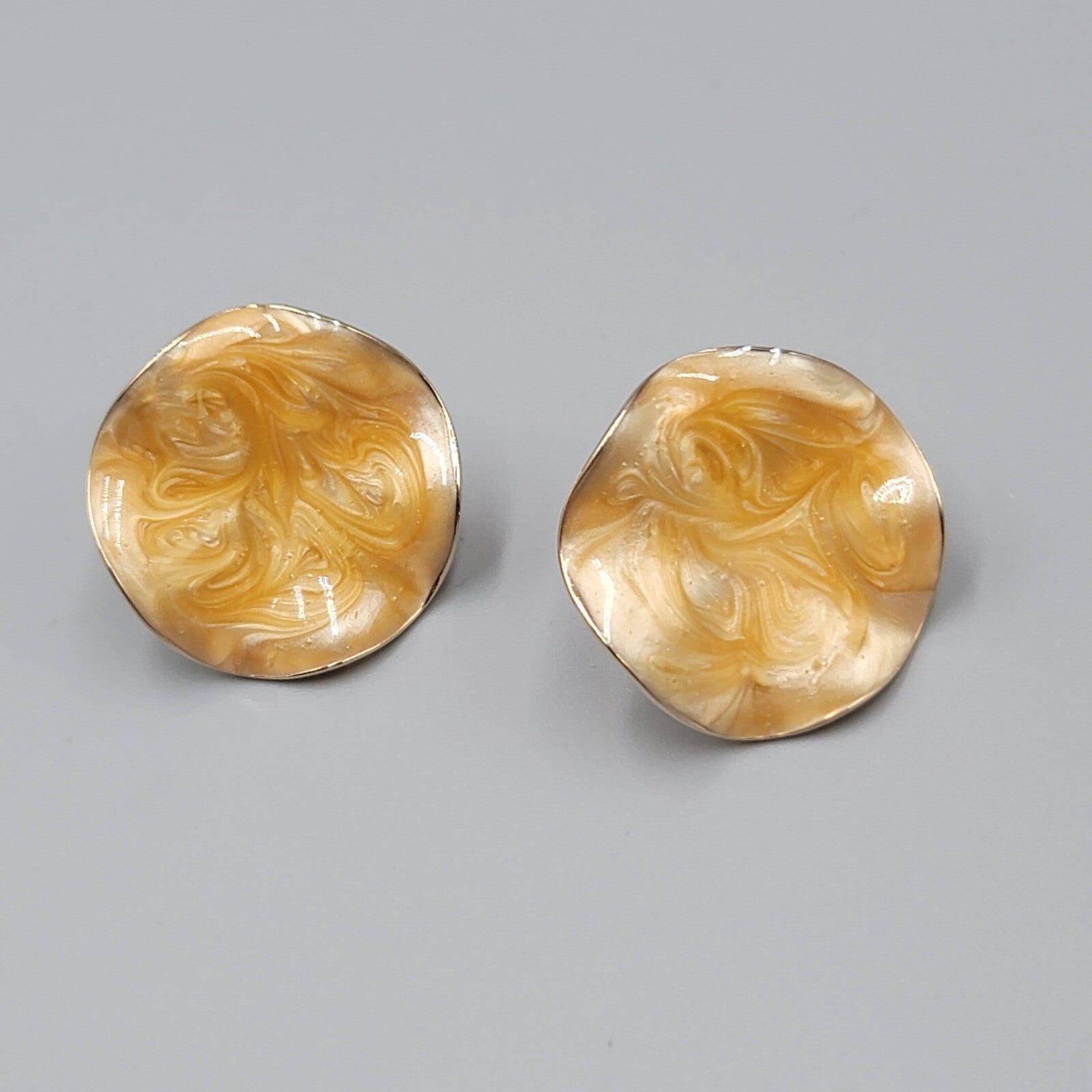 Vintage AVON Clip on Earrings Gold tone Light Orange Swirl Enamel Wavy Round 1"