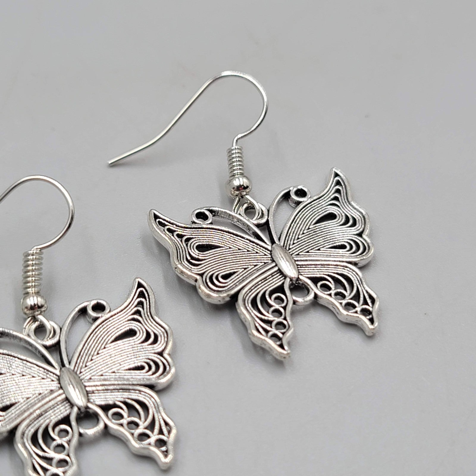 Filigree Butterfly Pierced Earrings Silver tone Dangle 1"