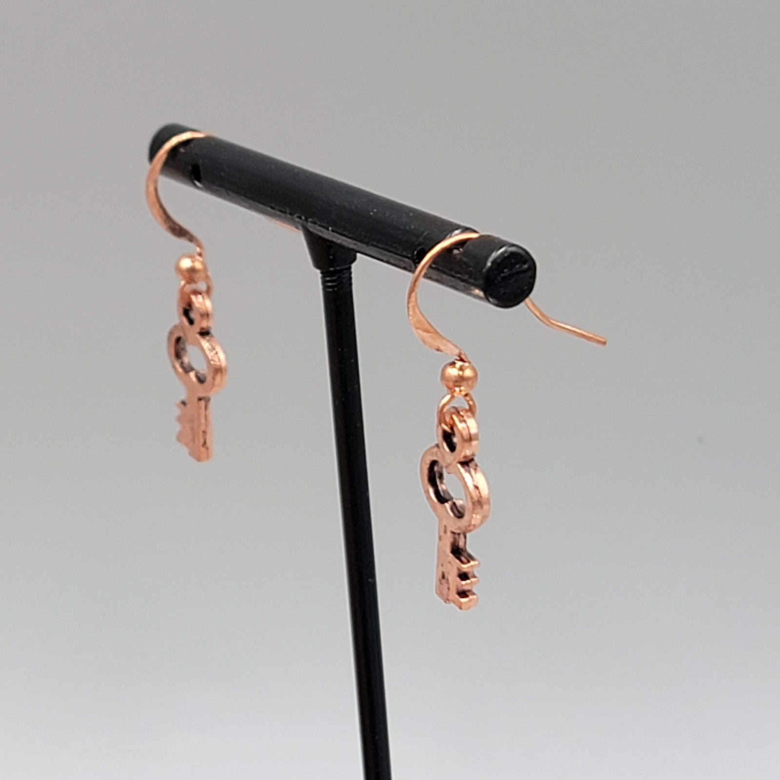 Small Copper tone Skeleton Key Pierced Earrings Dangle 5/8"