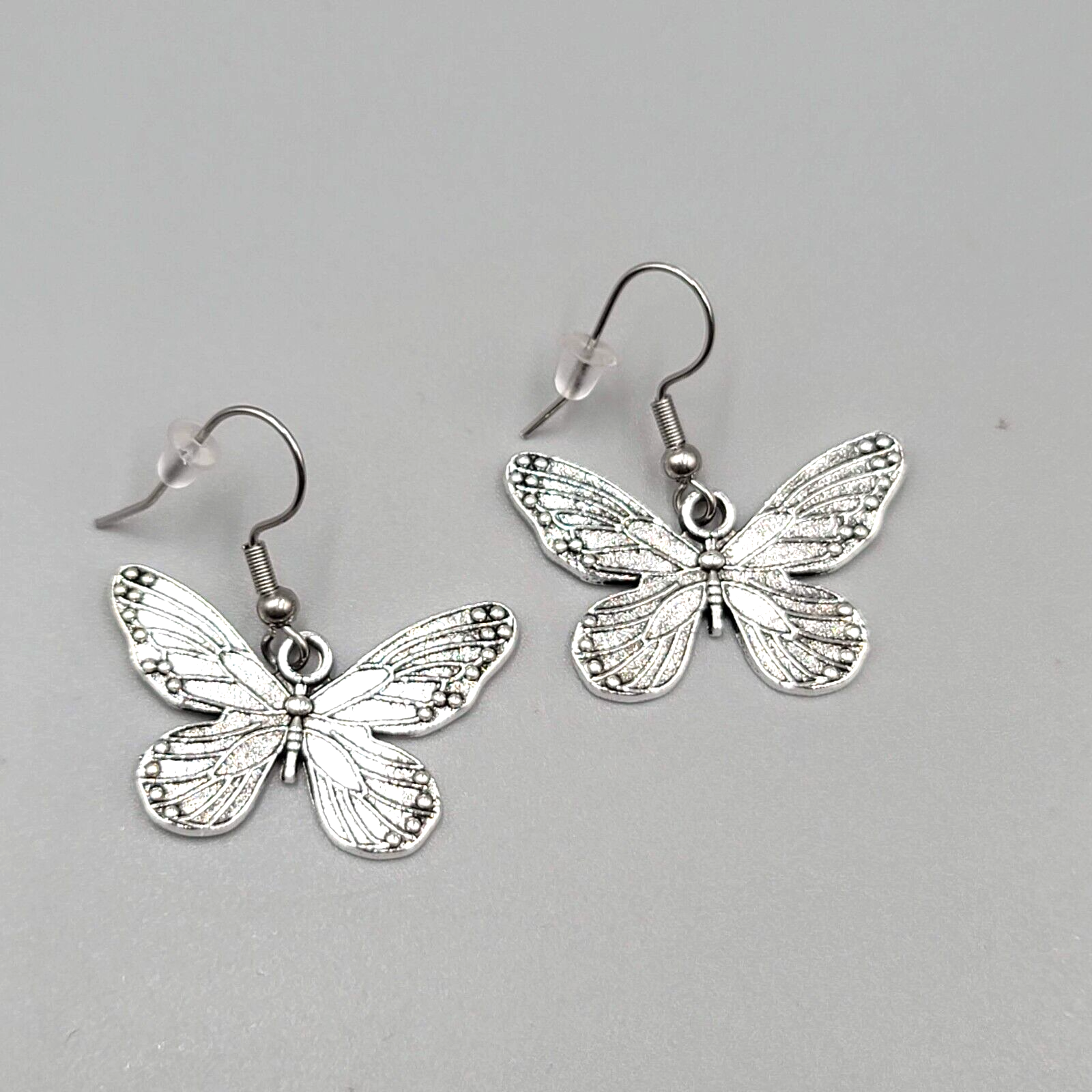 Butterfly Pierced Earrings Silver tone Embossed Dangle 3/4"
