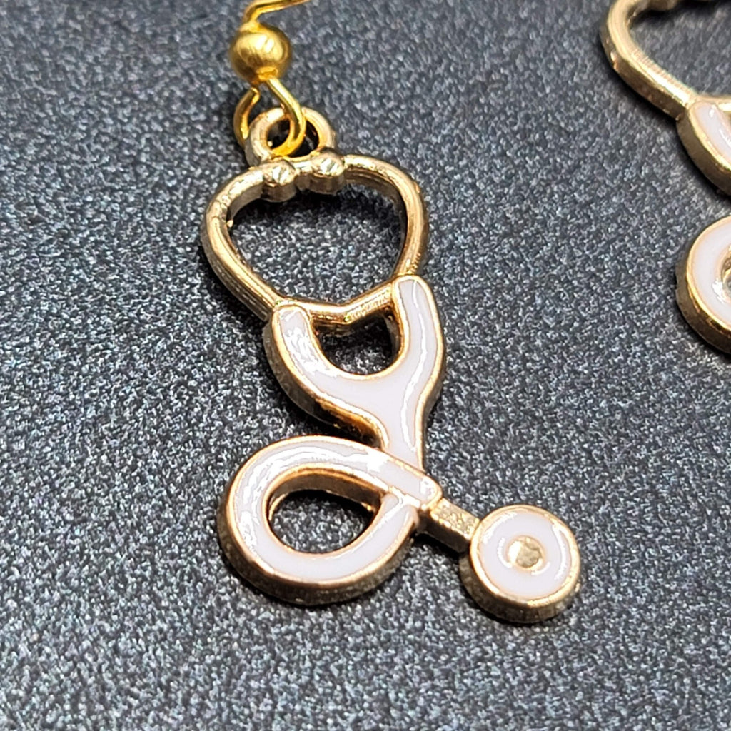 Nurse Pierced Earrings White Enamel Stethoscope Gold tone Dangle 1 1/8"