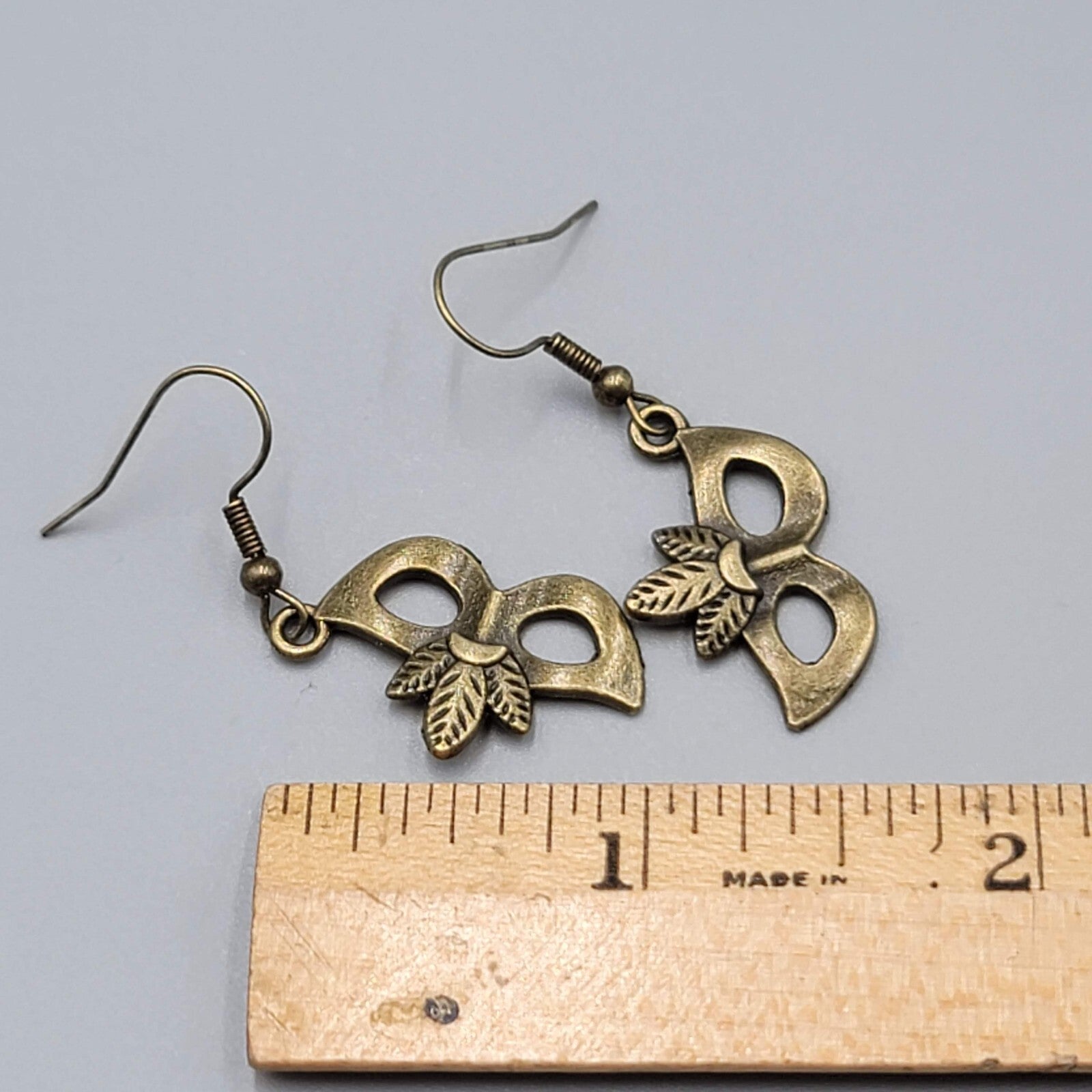 Masquerade Mask Pierced Earrings Bronze tone Metal Embossed Leaves Dangle  1"