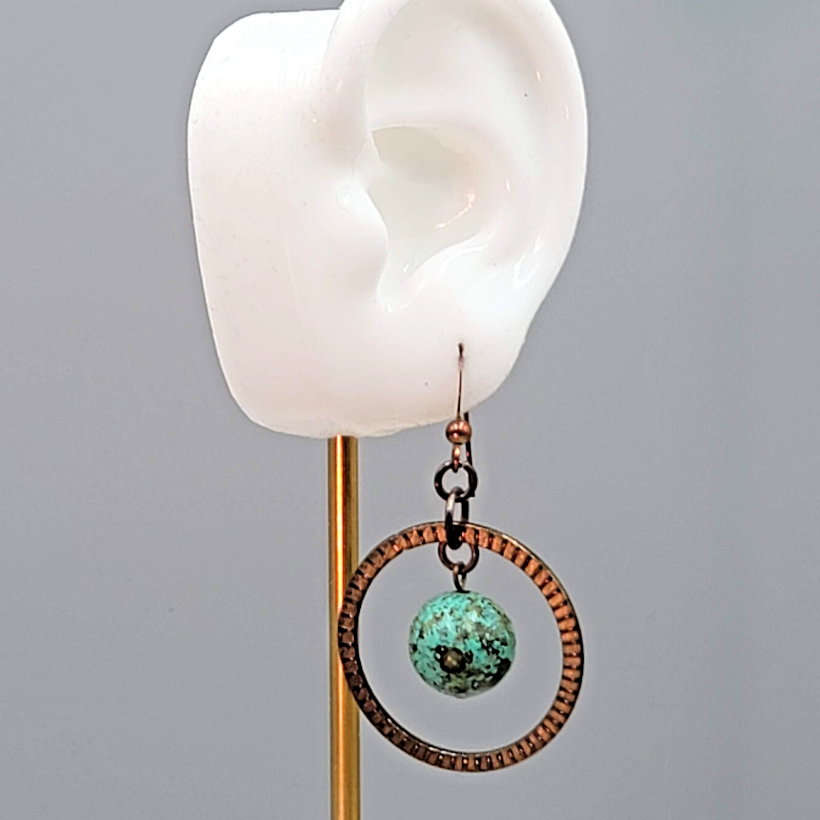Bronze tone Dangle Pierced Earrings Green Bead Center Dangle 1.5"