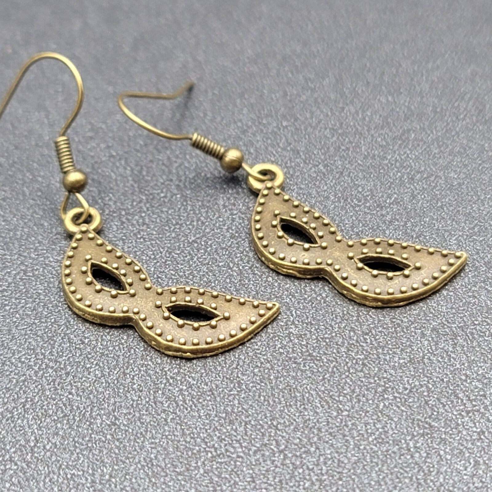 Masquerade Mask Pierced Earrings Bronze tone Metal Embossed Dots Dangle  1"