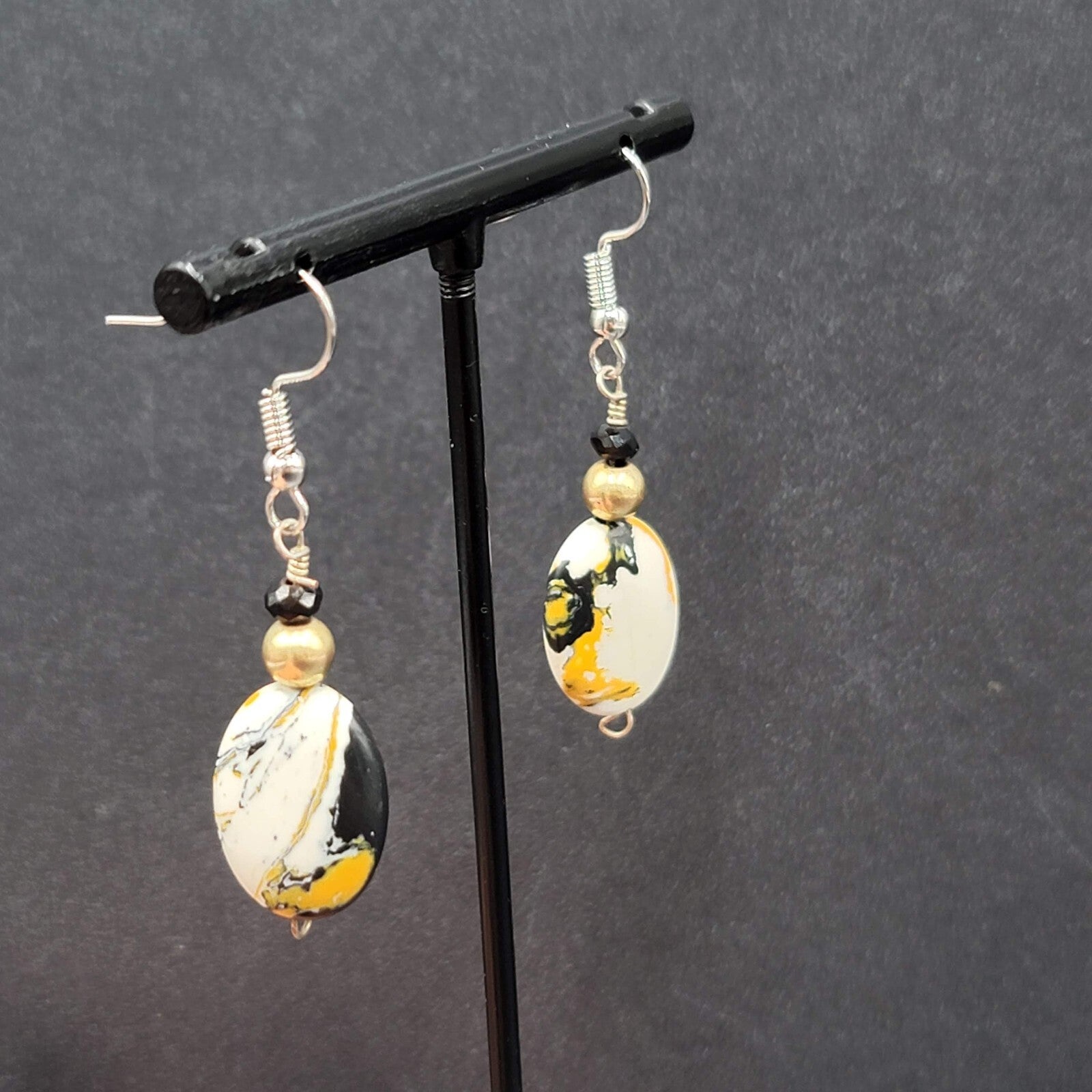 Pierced Earrings Silver tone Black White Yellow Art Glass Oval Bead Dangle 1.25"