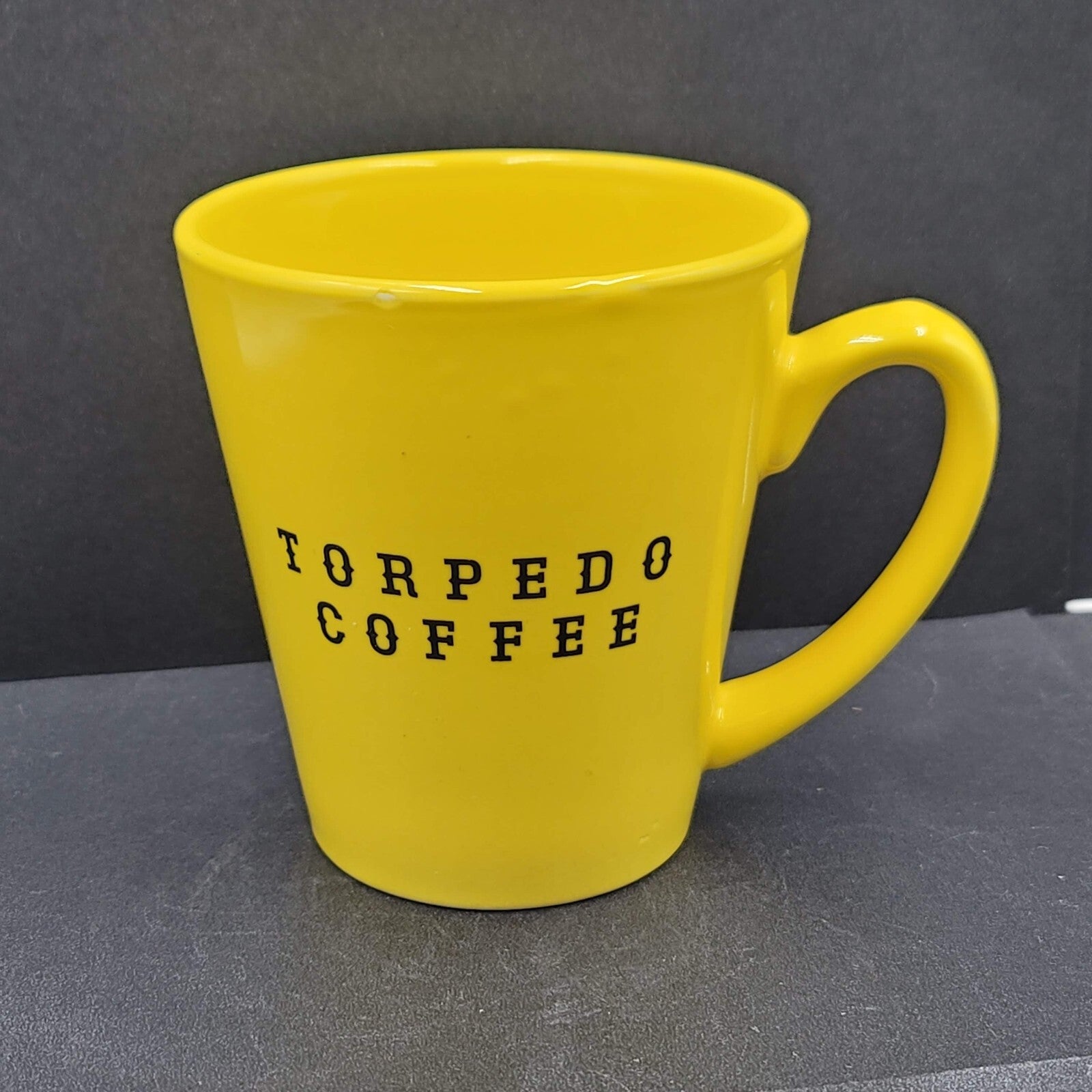 Torpedo Coffee Mug Cup Yellow Winky Face iti