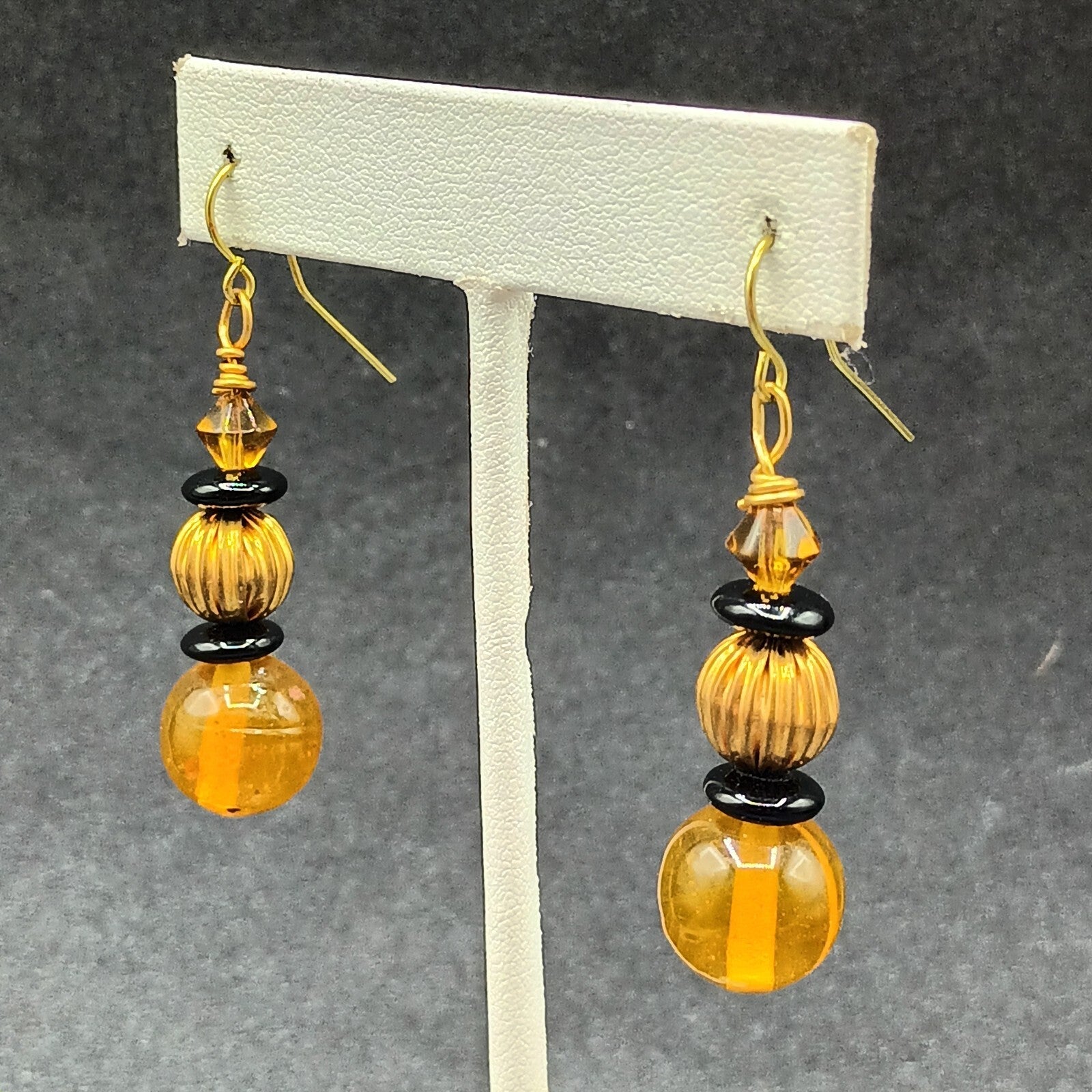 Pierced Earrings Gold tone Orange Black Beaded Statement Dangle 1.5"