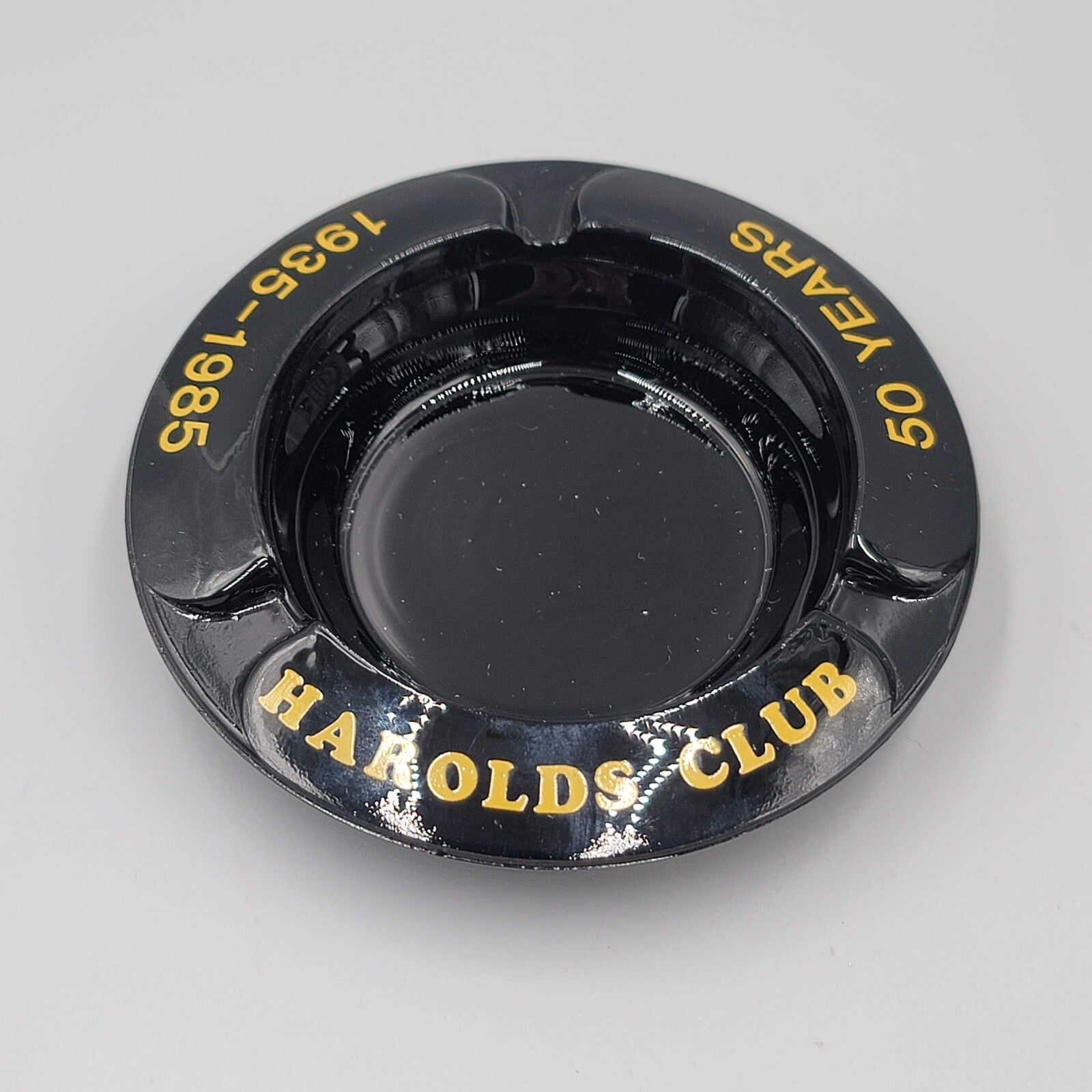 Vintage Ashtray Round Black Gold Print Harolds Club 50 Years 1935-1985 4"